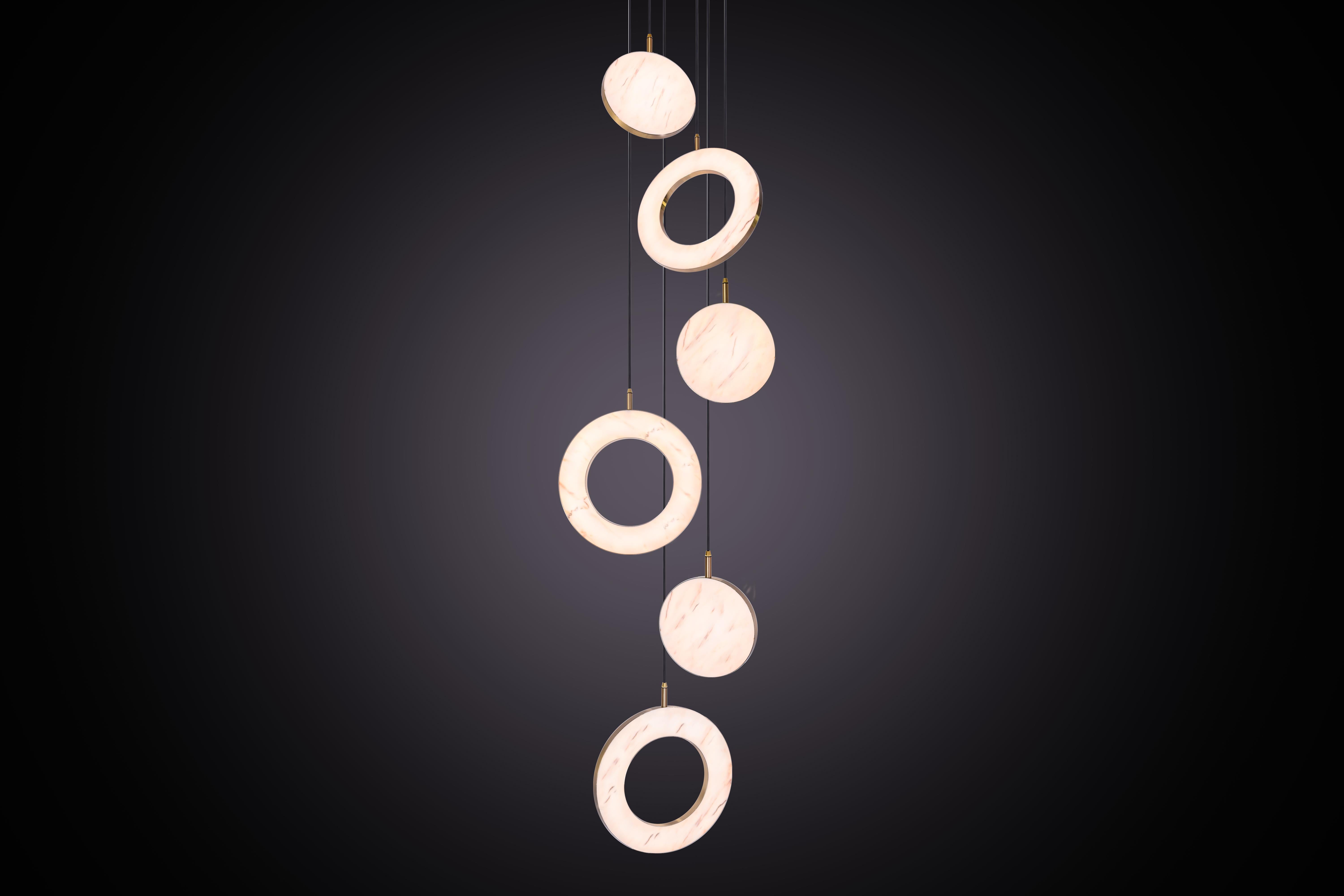 The Rosa Rings collection was designed to showcase the opaque beauty of natural marble. The pendant incorporates a backlit Rosa Estremoz marble disc that emits a soft, warm illumination, pierced by the natural veining of the stone.

Integrated