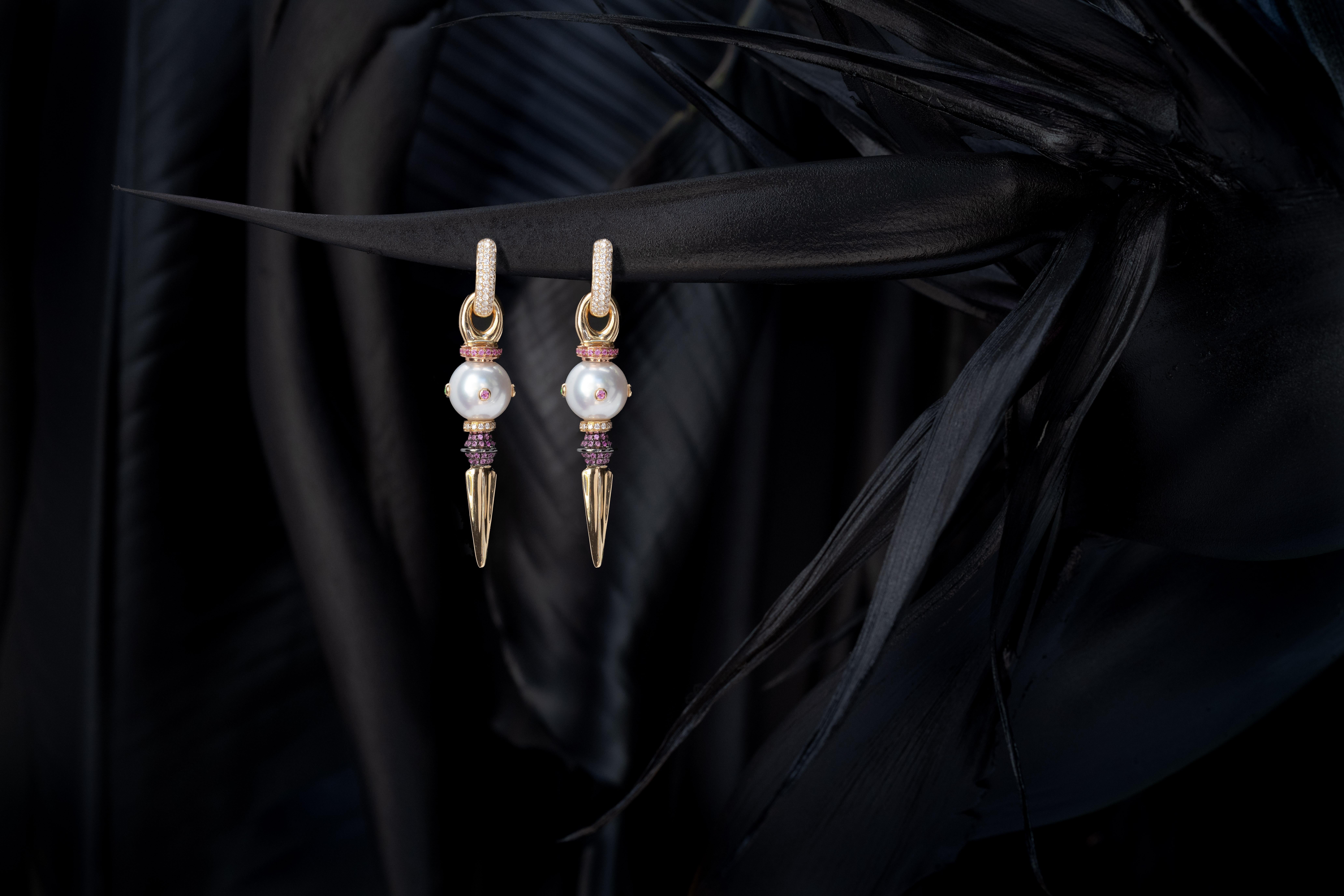 11.5mm Australian South Sea Pearls (AAA quality) with encrusted multi-color Sapphires in 18 Karat yellow Gold, with 18 Karat rose Gold and black Diamonds sliders and 18 Karat yellow and black Gold with pink Sapphires small dagger. 
Shown on 18k