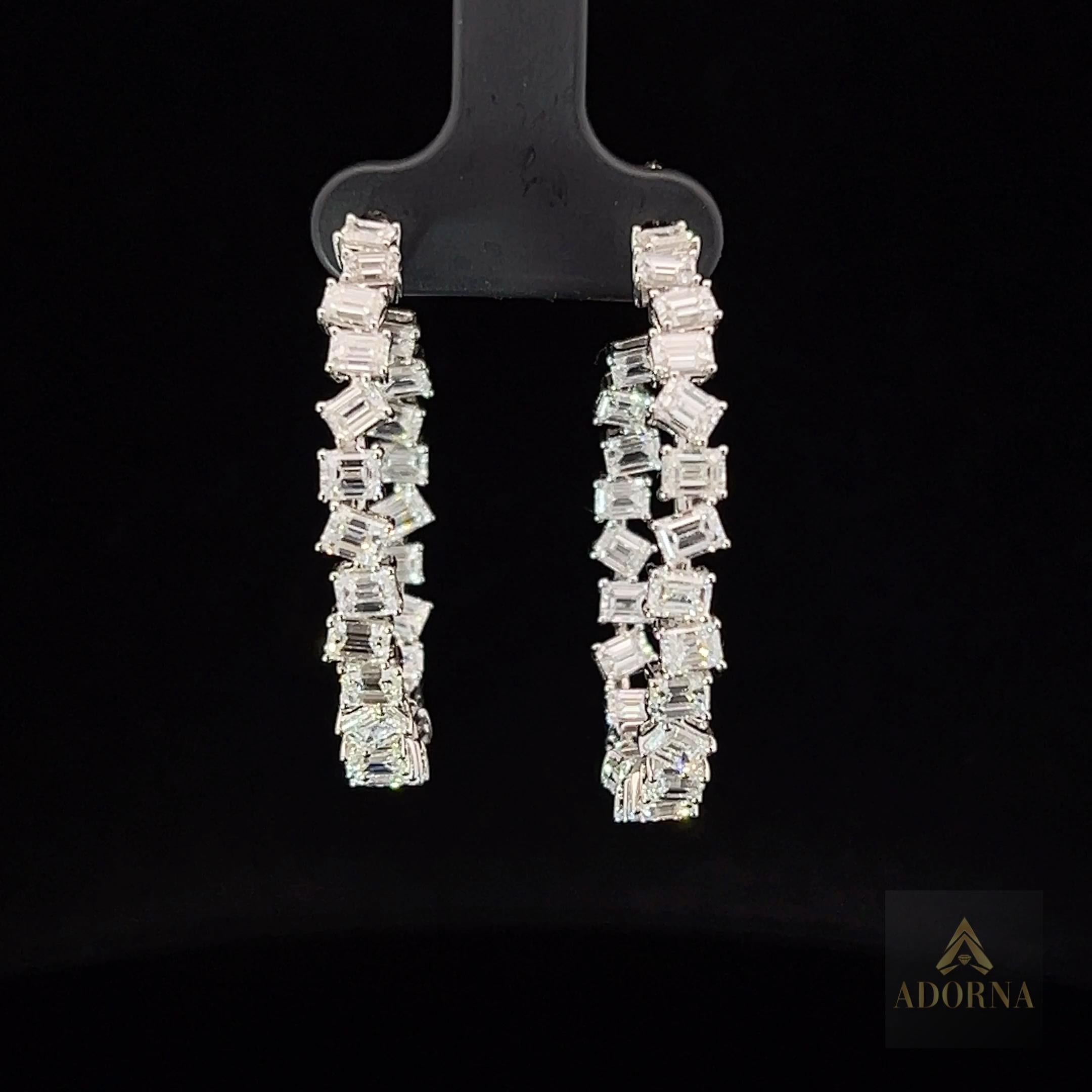 Earring Information
Diamond Type : Natural Diamond
Metal : 18K
Metal Color : White Gold
Diamond Carat Weight : 7.35ttcw
Emerald Diamonds Count : 50


JEWELRY CARE
Over the course of time, body oil and skin products can collect on Jewelry and leave a