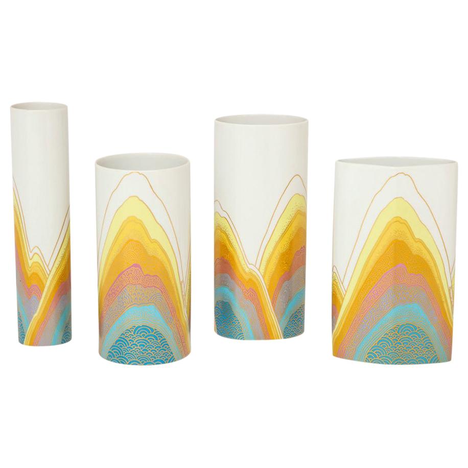 Set of four Rosamonde Nairac for Rosenthal Studio Line porcelain vases, white, yellow, blue, signed. In the 1970's, Rosenthal Studio-Line commissioned artist Rosamonde Nairac to design several new patterns. Nairac used bold psychedelic abstract