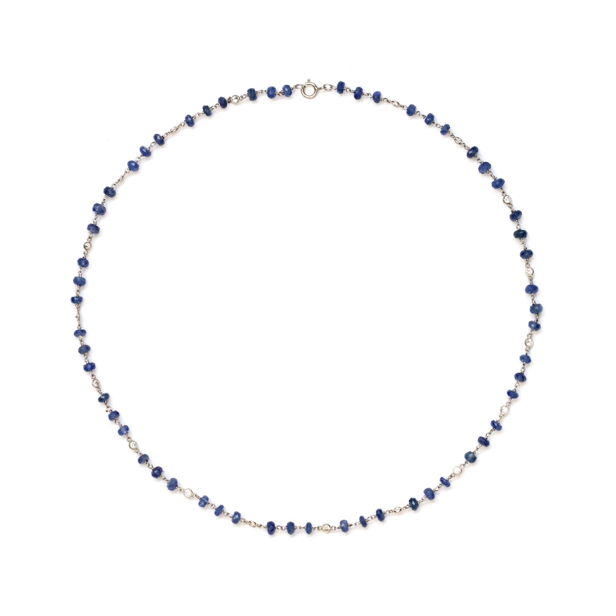 A dainty hand made necklace created by Rosaria Varra. It features natural faceted blue sapphire beads alternated with bezel set round diamonds in the style of “diamond by the yard” setting. The necklace was hand executed in platinum. The diamond