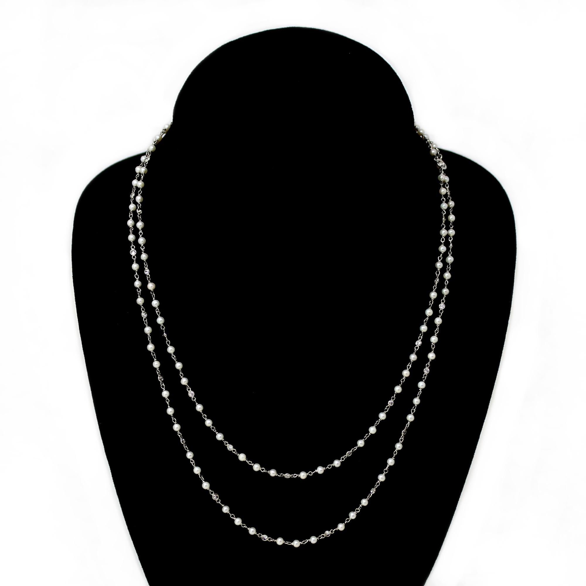 The hand made opera necklace is designed by Rosaria Varra. It features well matched seed pearls alternated with bezel set diamonds in the style of “diamond by the yard”. The necklace is created in platinum and is fully hand executed. The diamond