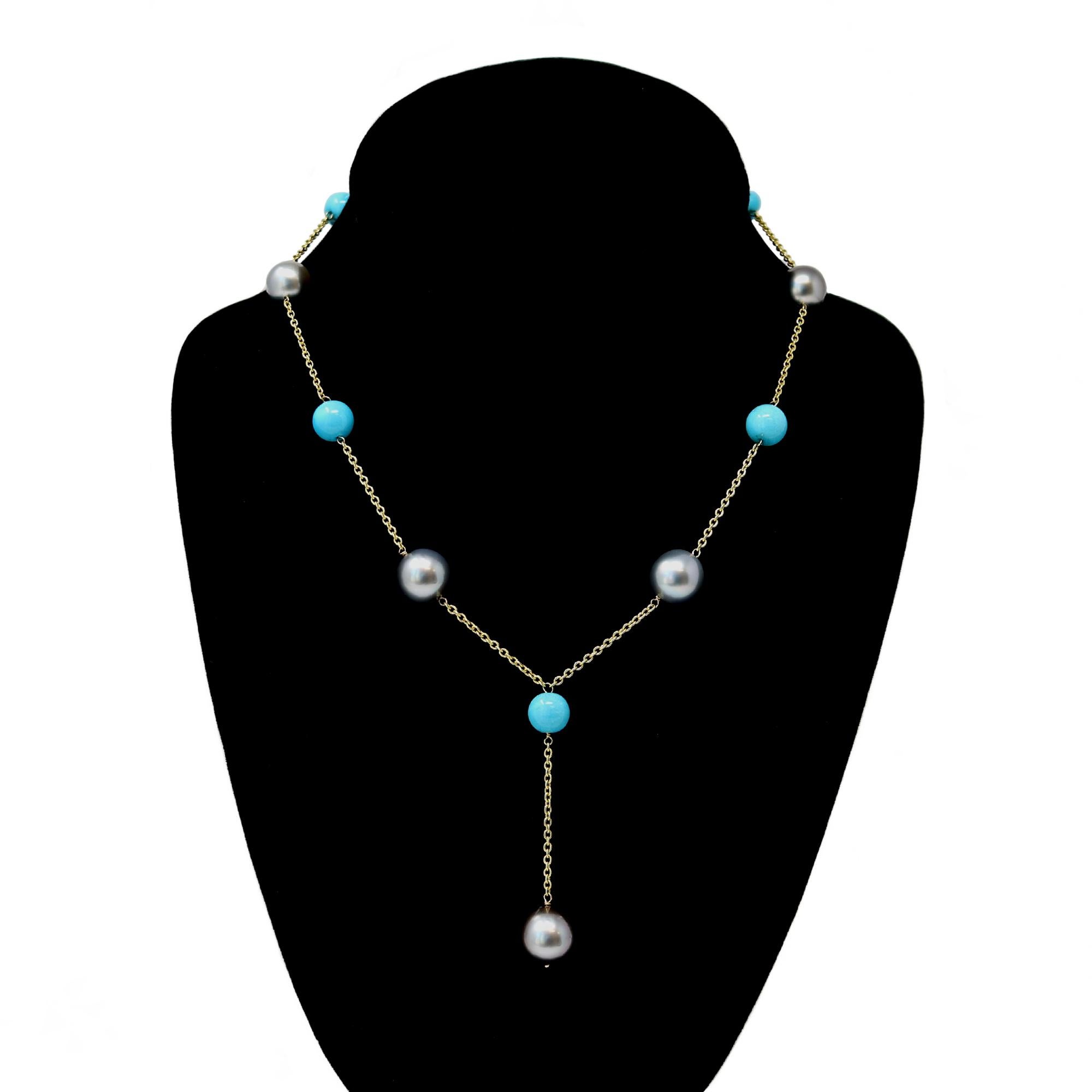 A lariat style necklace designed by Rosaria Varra featuring alternating Tahitian pearl and turquoise beads. The light grey tahitian pearls are round shape with excellent luster and minor surface inclusions, ranging from 10 to 12 millimeter in