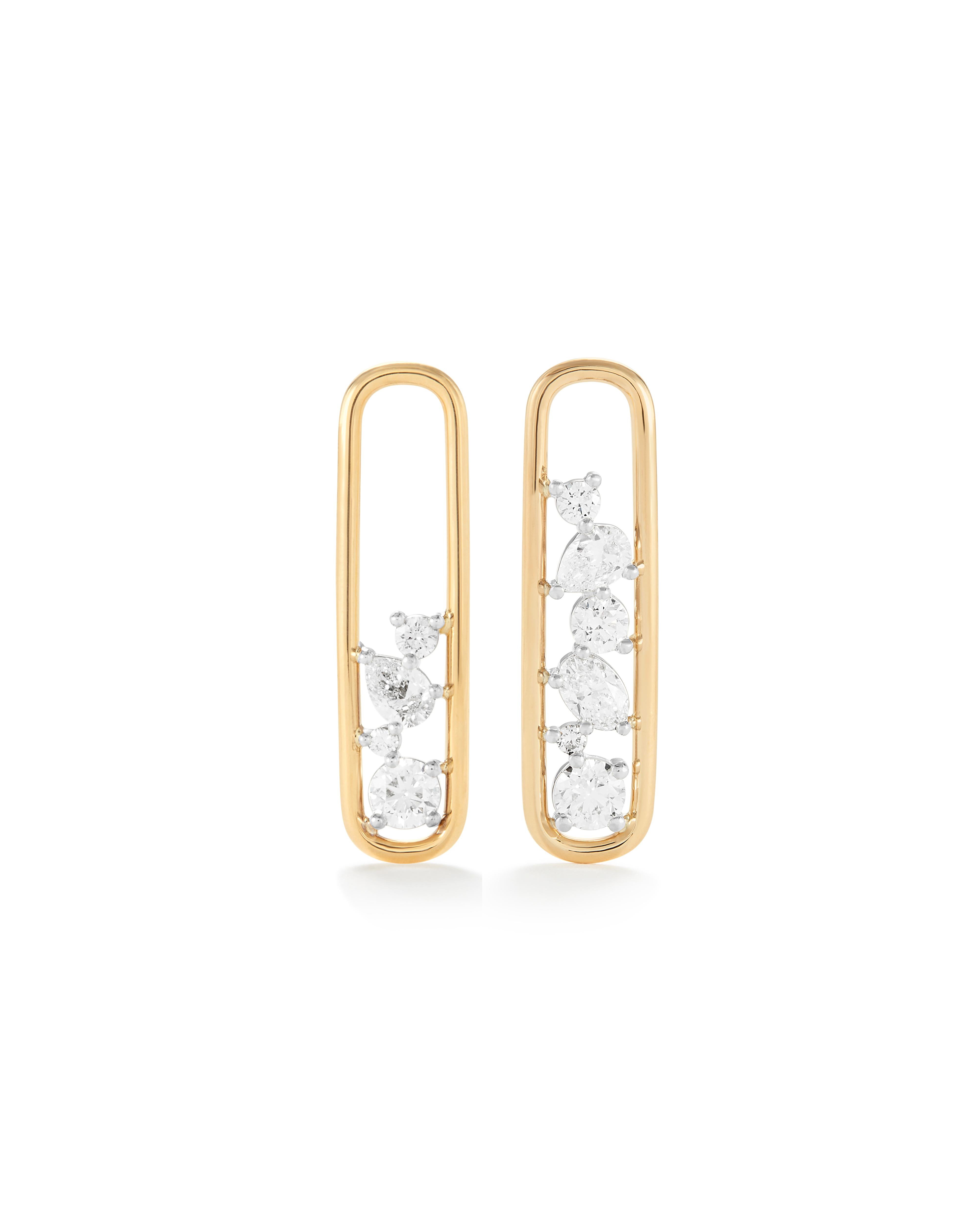 Dreamy drop earrings that will elevate any outfit! They are meticulously handcrafted in 18K solid gold with varying sized round, pear and oval shaped natural diamonds set in platinum. 

The Mara Collection was built around the beauty of negative