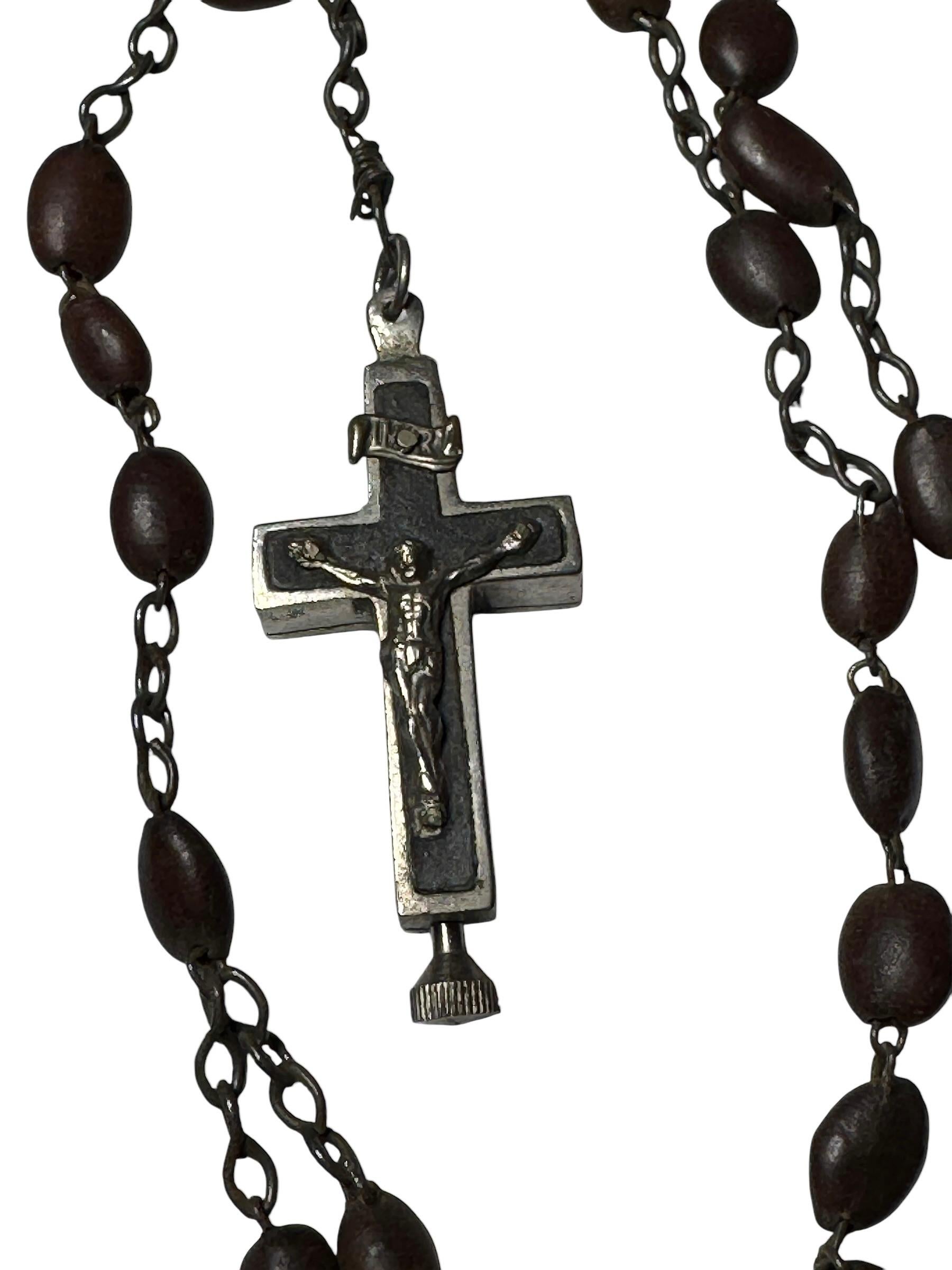 This vintage reliquary contains relics of a Saint. It is made of metal. It's 1 1/2