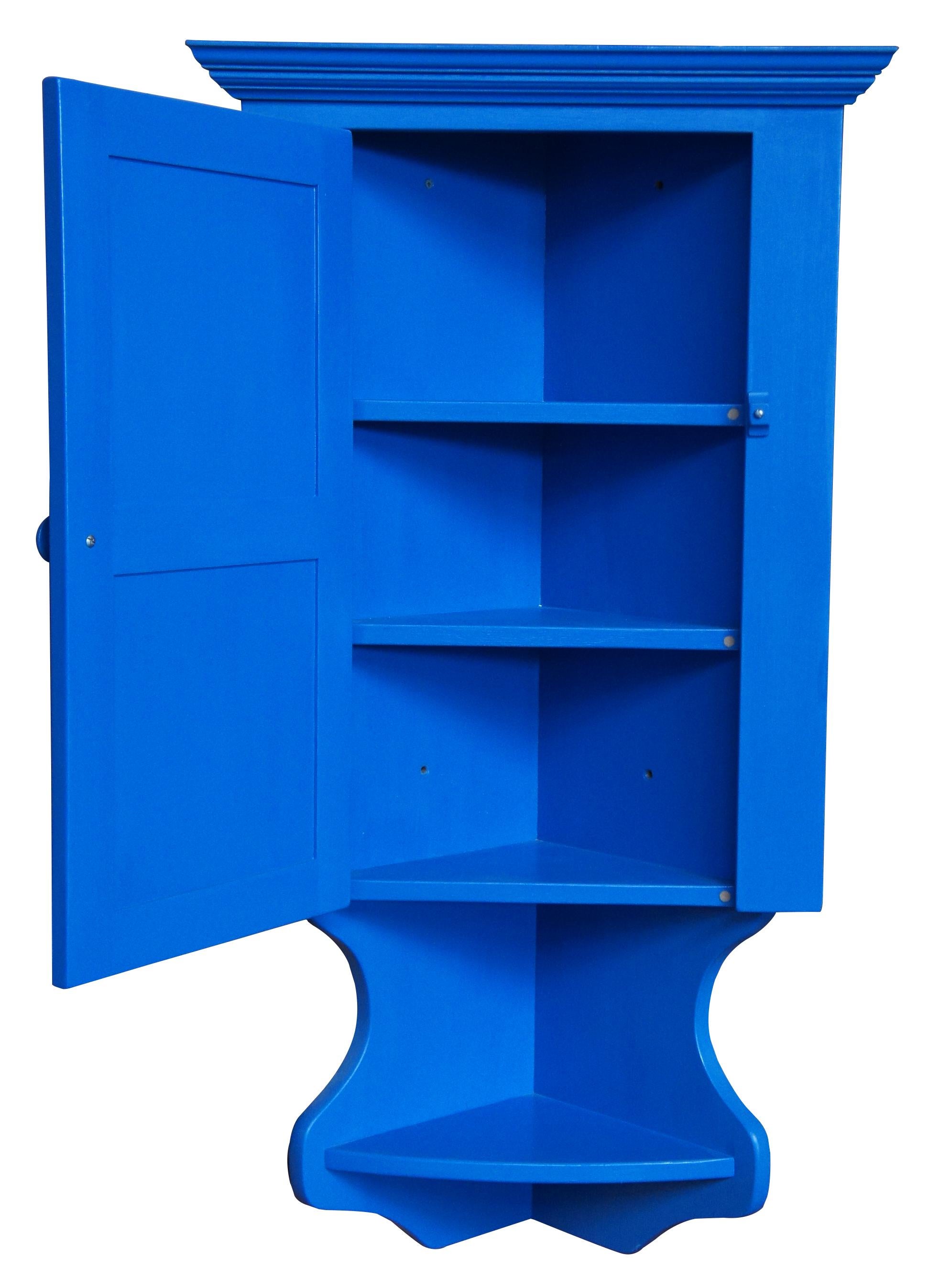 Vintage Roscoe Village Early American style wall hanging corner cabinet featuring a paneled door with tiered shelving and painted in an electric blue finish.

Measures: 23.5