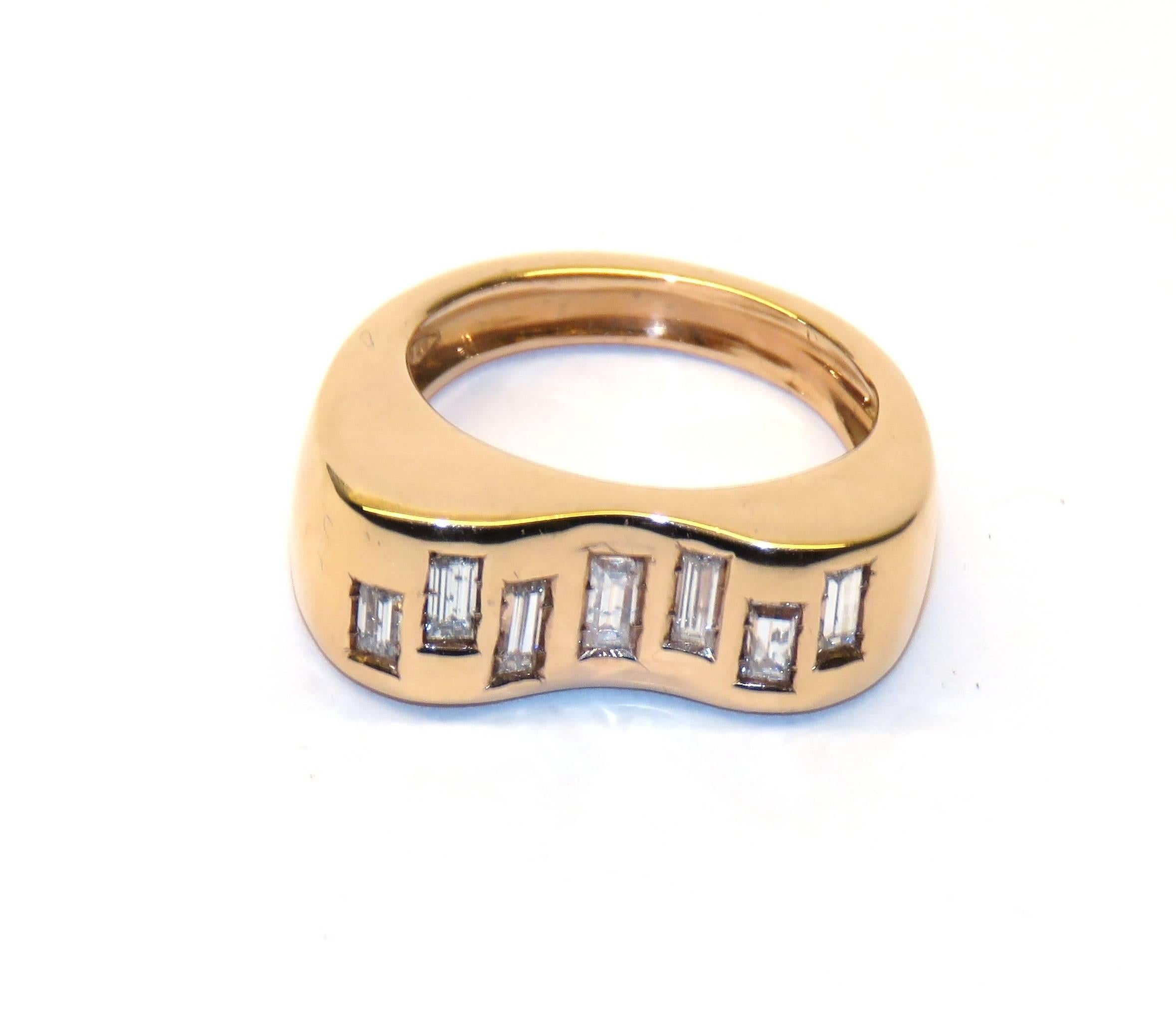 18k rose gold ring with baguette cut diamonds. Diamonds carat: 0.50. 
US size: 6 1/2, it can be resized. 
It  is stamped with the Italian Mark 750 - 716MI.
Baguette cut diamonds gave me the idea to adorn pieces of jewelry creating a Diamond Code