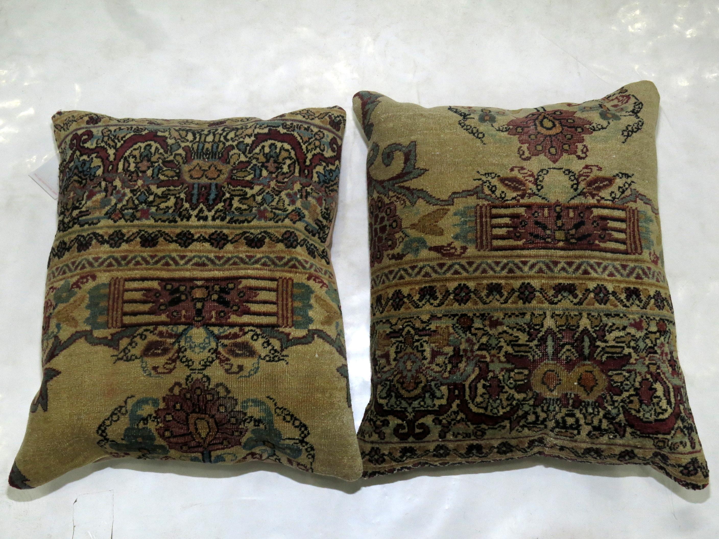Set of pillows made from a 19th century Persian Kerman rug. Both measure 16'' x 19''.