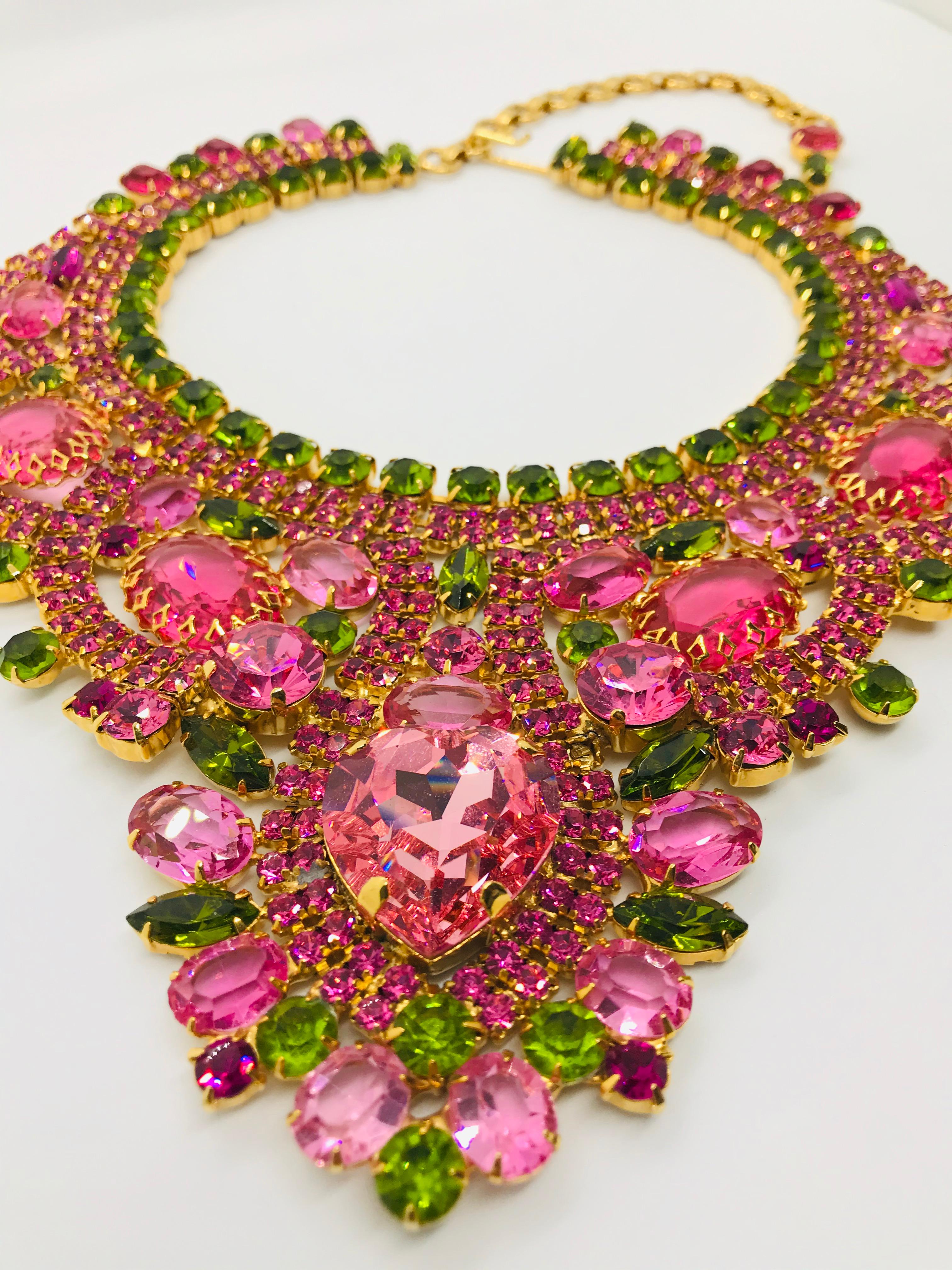 A great bib necklace transforms any outfit from the ordinary to the extraordinary!  Our rose and olivine vintage Swarovski crystal bib necklace features a heart shaped center stone with a mix of foiled and unfoiled crystals throughout the body of