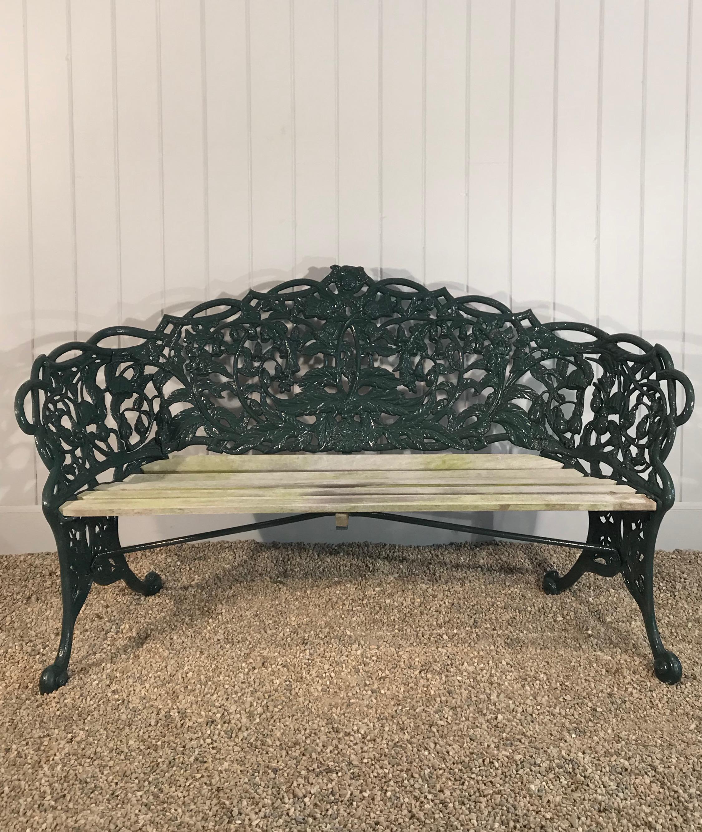 This rare cast iron bench was made in 1858 by the famed Glaswegian Maker, Thomas Perry and Sons and is in perfect condition. It has recently been sandblasted and powder-coated in a dark green and the seat has been replaced with natural oak slats.