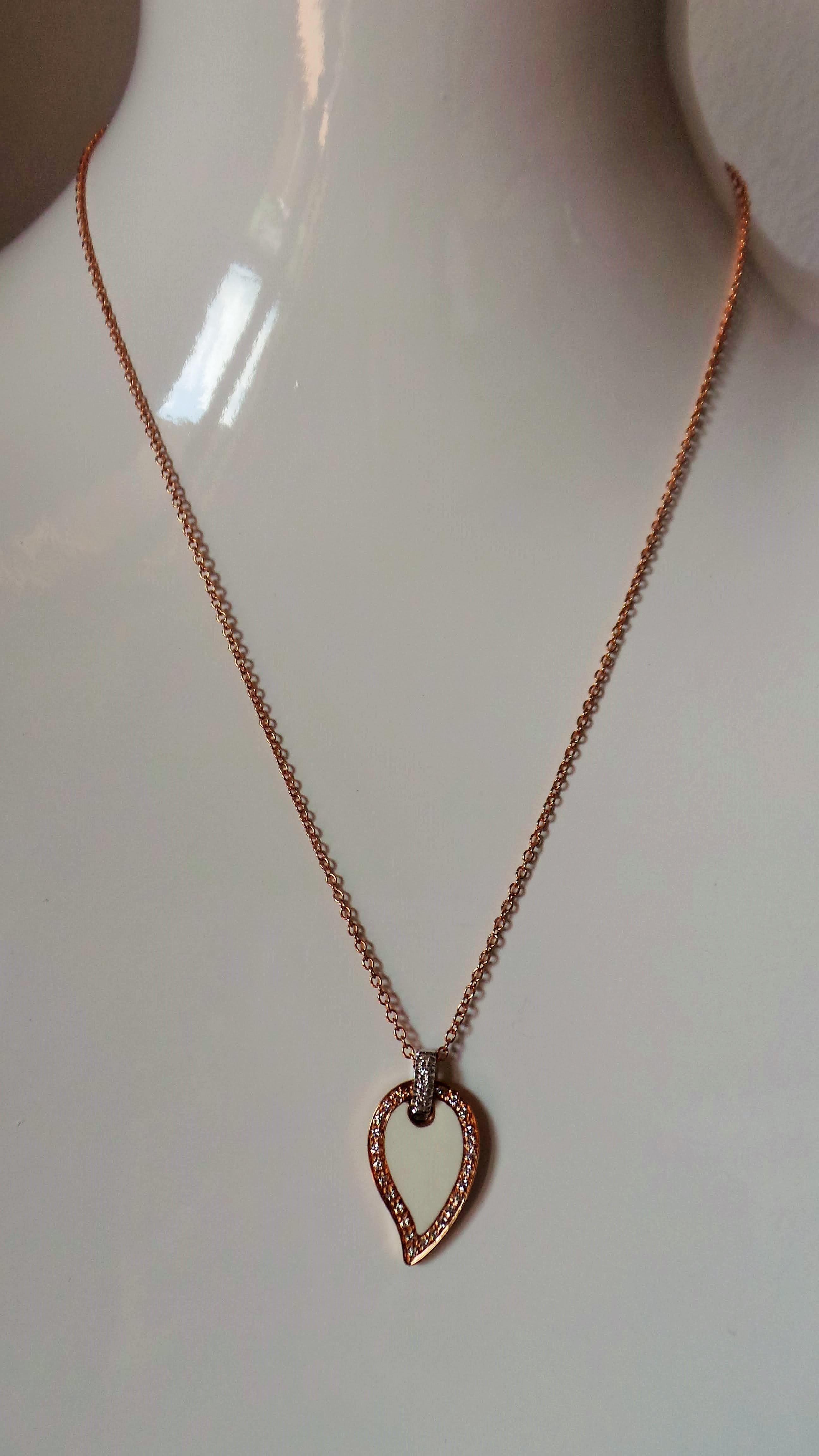 Andrea Macinai created this enamelled design for pendant and hand-set stones with 0.23 carats white diamonds cut brillant.
This enchanting pendant necklace is entirely handmade in white and rose gold. This line of pendants is very elagant and the