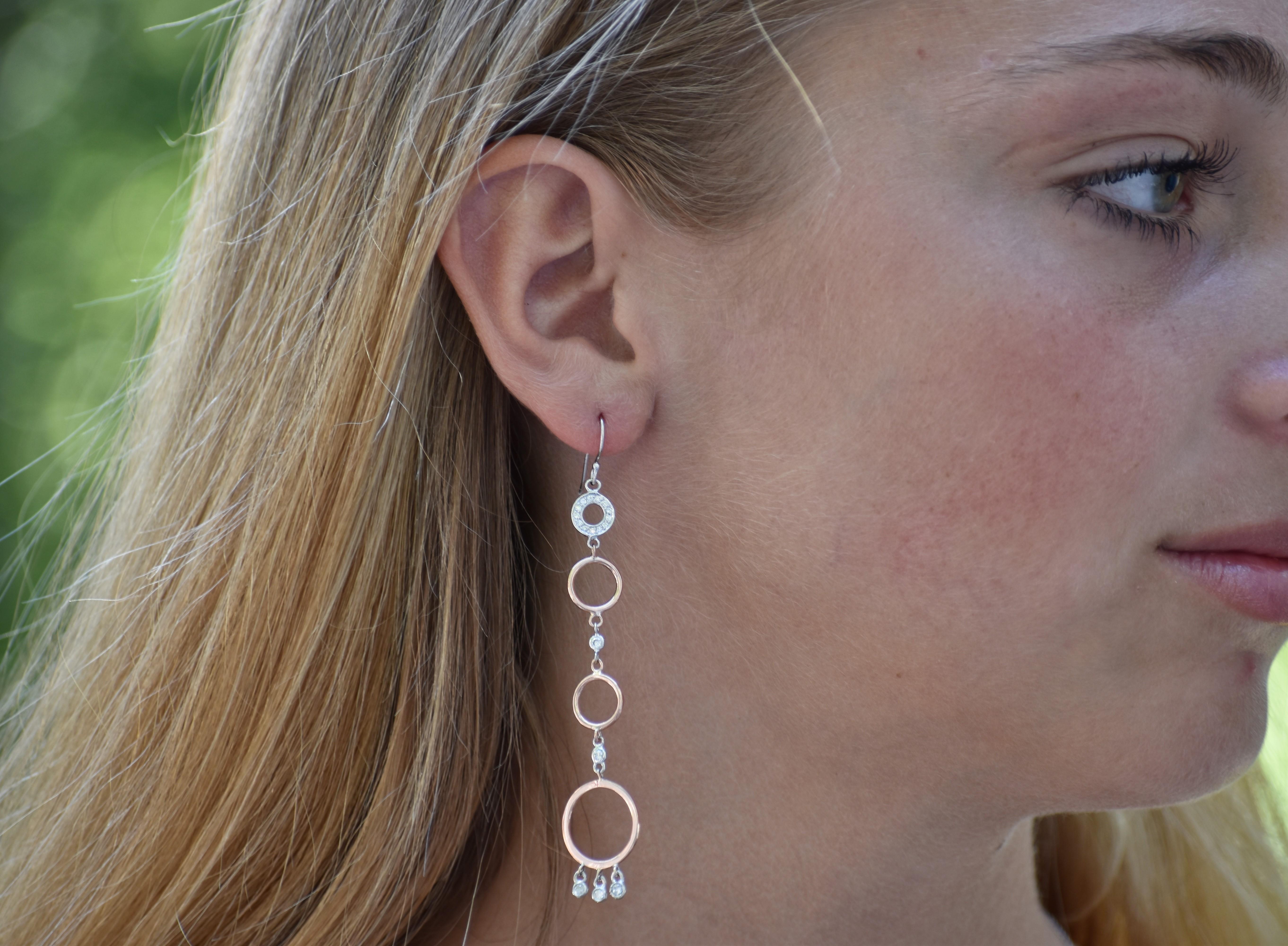 Featuring 14k diamond circle hoop dangle earrings
Metal White alternating with rose gold 
Earrings 3.25