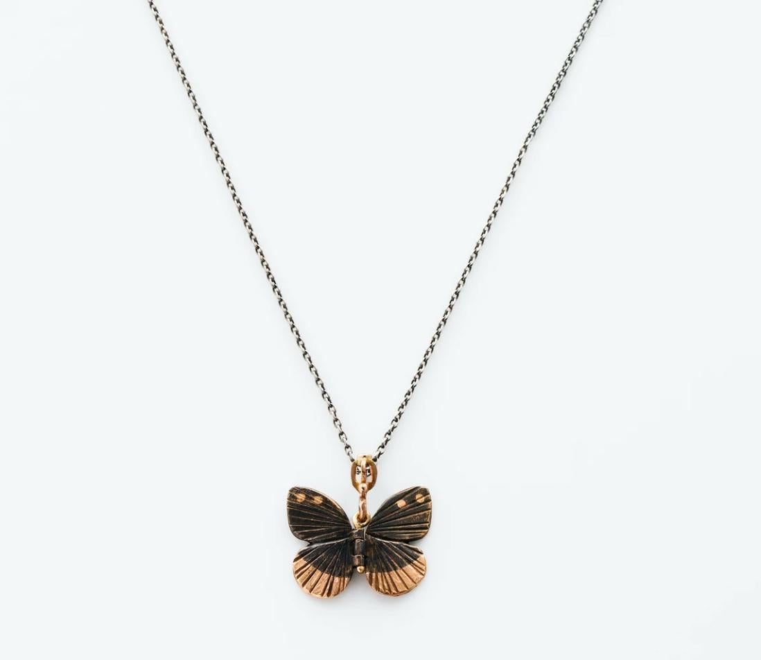 James Banks's signature butterfly necklace features a Baby Asterope butterfly with a hinge at the center to allow movement of the wings, set in Rose Bronze with 14k Rose Gold inlay at the tips, 14k Rose Gold crown & hook, hung on a 17