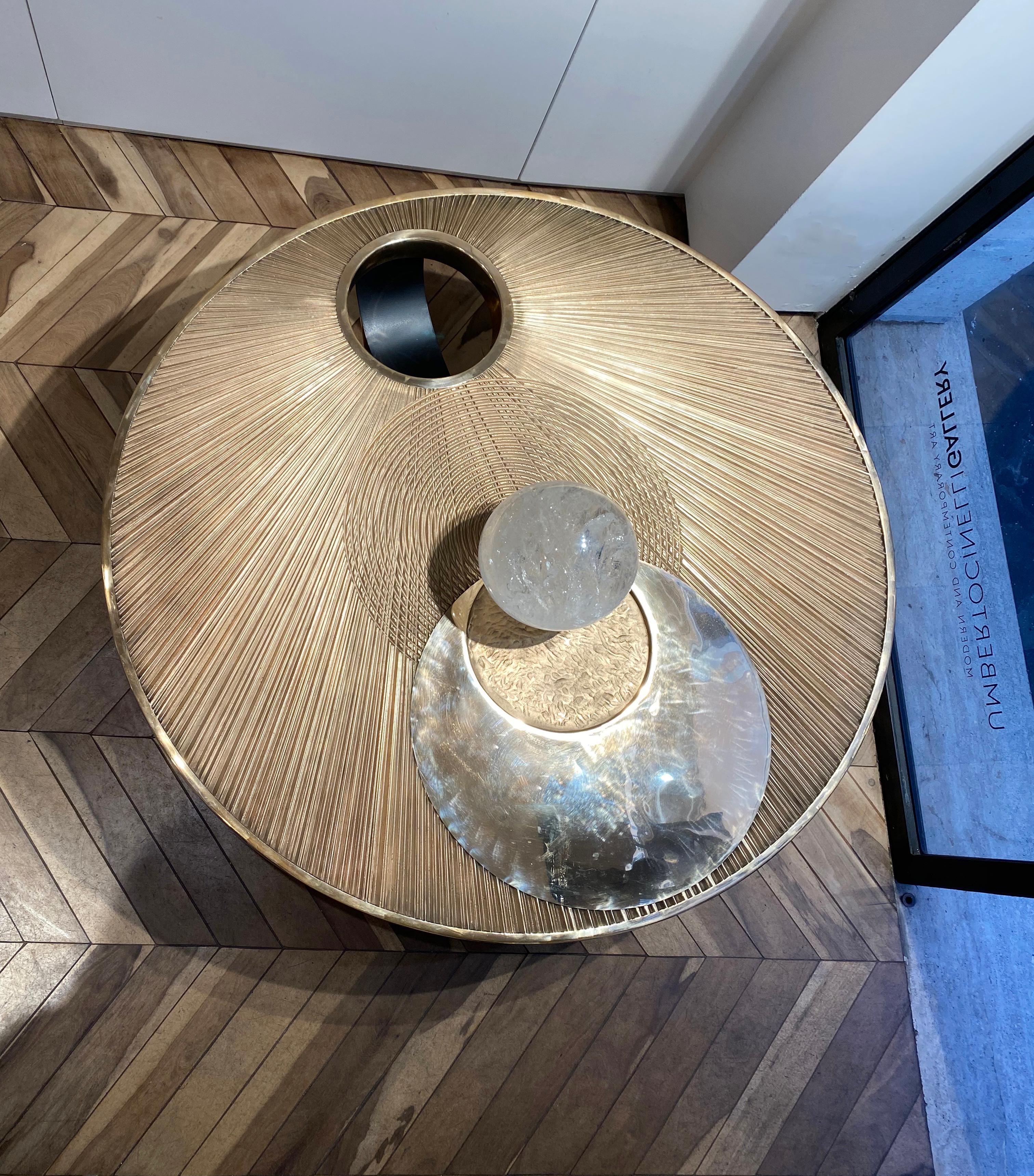 Artistic casted Rose bronze coffee table. 
The engraved detailed round top represents the solar eclipse of year 2014, where the sun met the moon, that ideally kiss each other.
With this platonic and romantic idea the Italian artist Umberto Cinelli