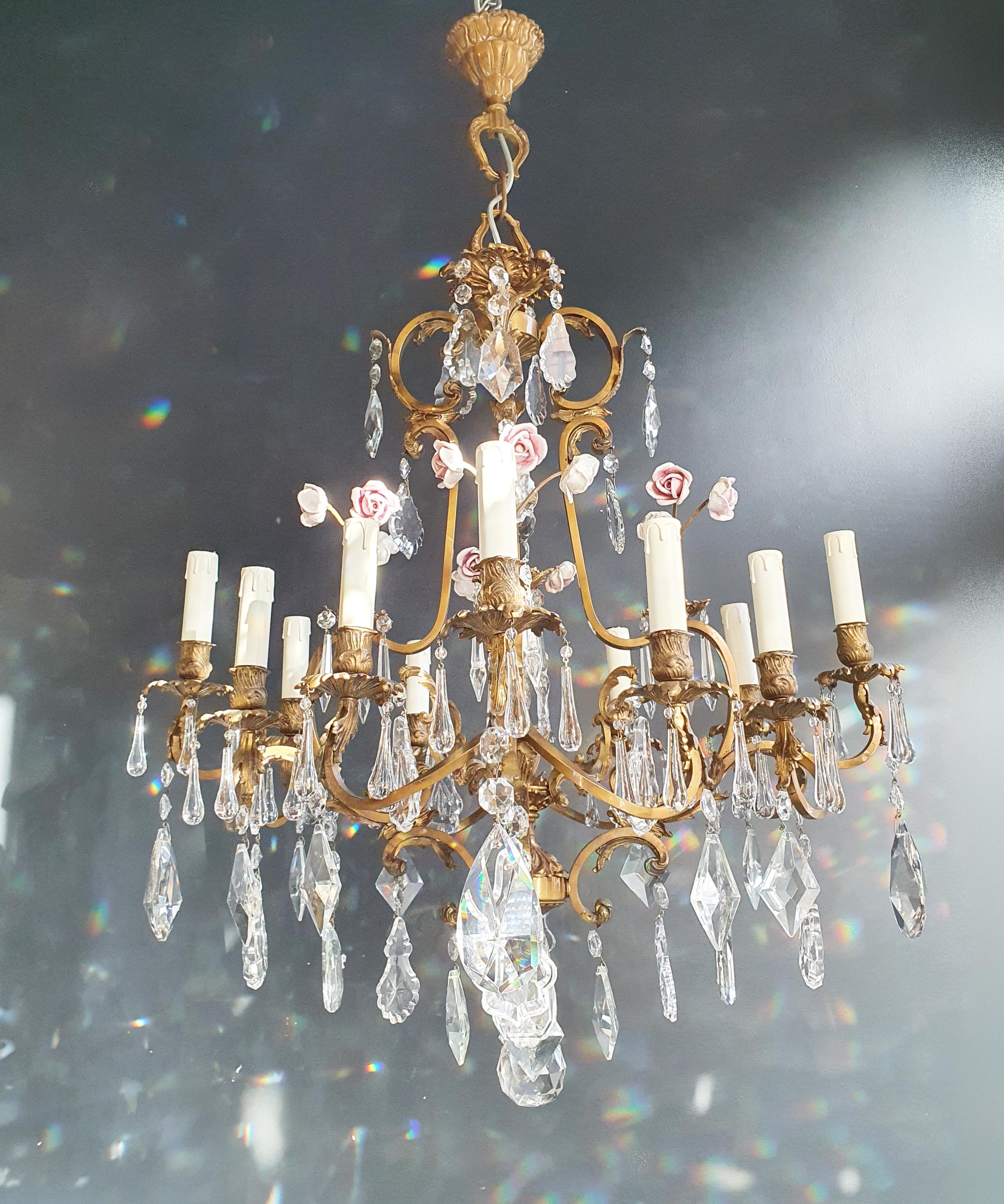 Rosy crystal antique chandelier ceiling florentiner lustre Art Nouveau

Measures: Total height 105 cm, height without chain 85 cm, diameter 70 cm. Weight (approximately): 15kg.

Number of lights: 12-light bulb sockets: E14 material: Brass, cut