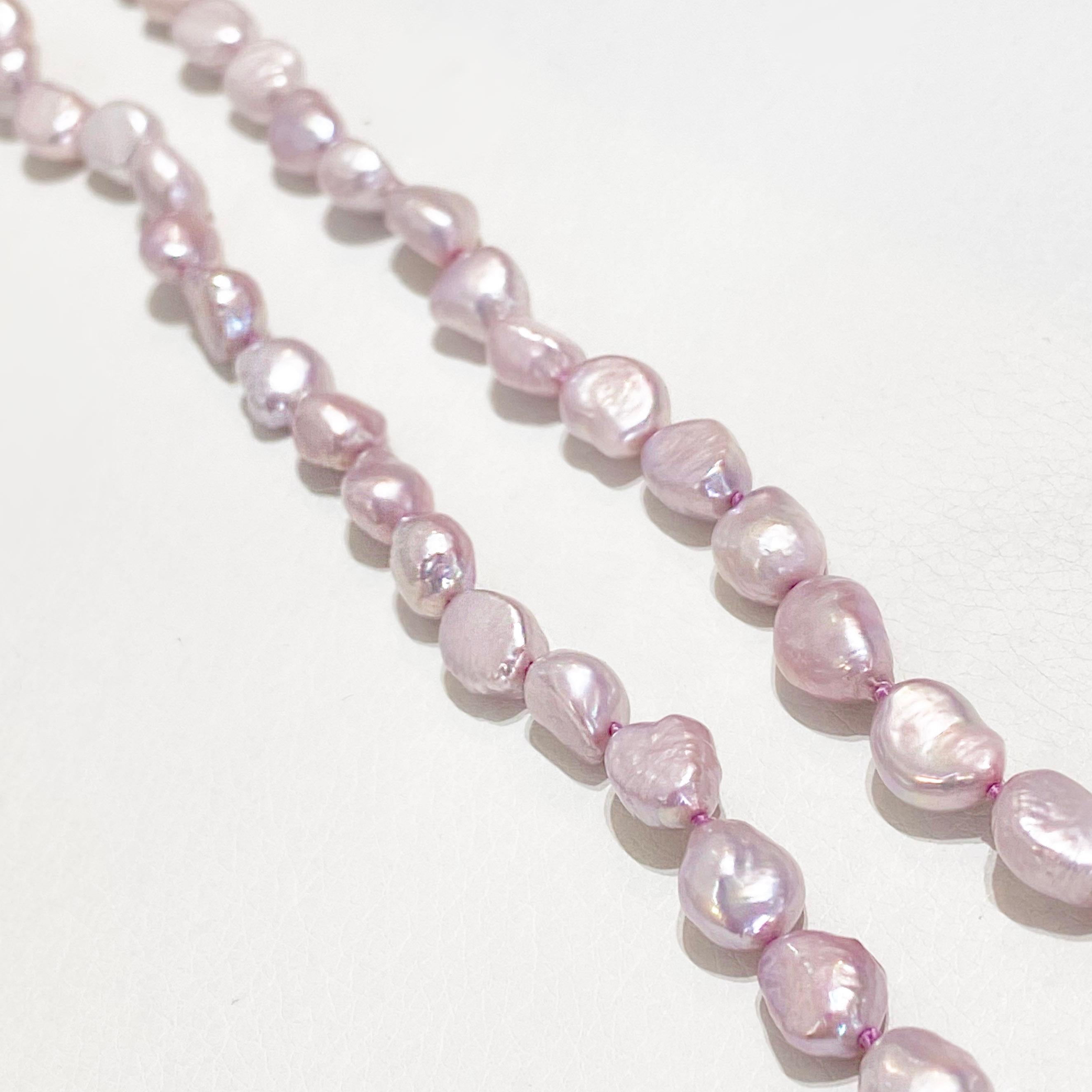 The details for this beautiful necklace are listed below:
Metal Quality: Sterling Silver
Pearl Type: Beaded Pearls
Chain Length: 35.5 inches
Clasp Type: Lobster
Gemstone: Cultured Pearls
Gemstone Number:72
Gemstone Shape: Off Round, Unusual
Gemstone