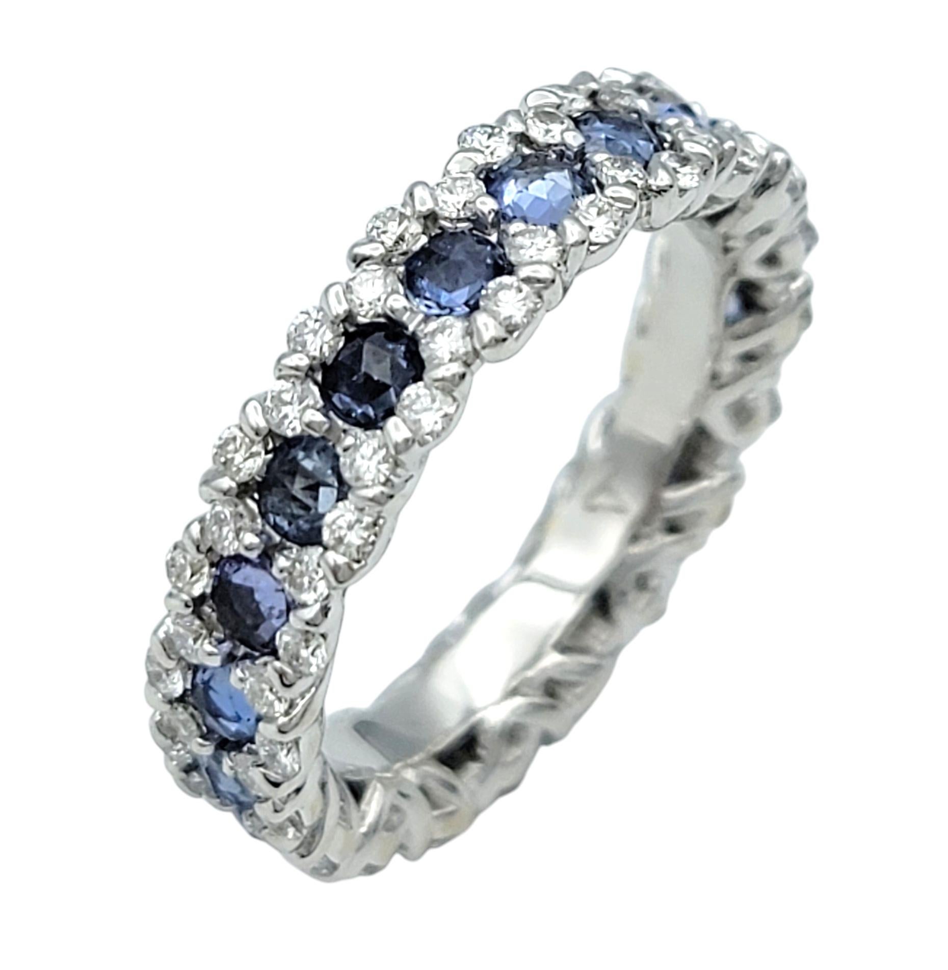 Ring Size: 5.5

Experience the captivating beauty of this elegant eternity band, expertly crafted in 18 karat white gold and adorned with a mesmerizing combination of natural blue spinel and round brilliant-cut diamonds.

A seamless circle of