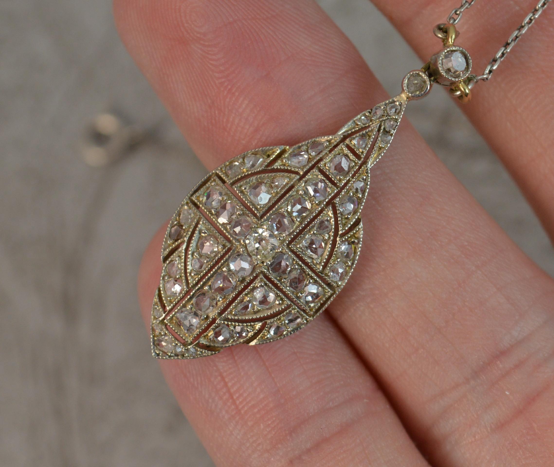 
A fantastic true antique pendant necklace.

Stylishly shaped pendant drop encrusted with a number of rose cut diamonds in grain settings. 

41 natural, original, rose cut diamonds.

Complete with fine link chain.

CONDITION ; Excellent. Crisp