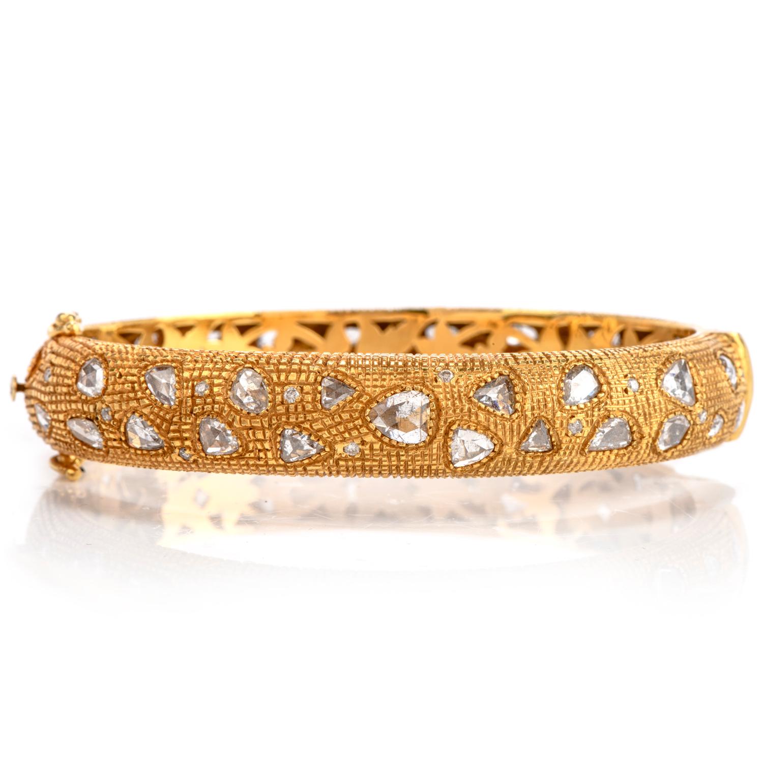 Estate 18K Diamond with textured 18k gold Bangle Bracelet in 35.2 grams of 18K yellow gold. Set symmetrically with approx. 40 large rose-cut dimaond and 25 round cut diamonds beded indide the gold bangle. 

Diamonds weigh approx. 6.63 carats. The