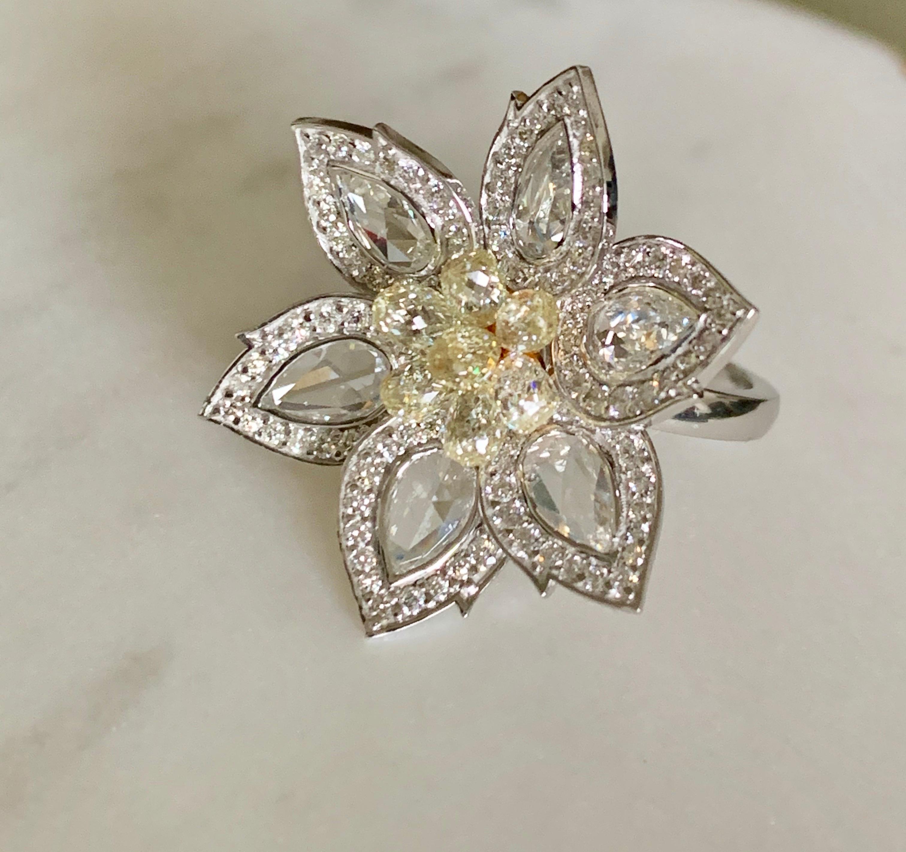 Moguldiam Inc Fresh and contemporary rose cut diamond and briolette diamond flower ring is beautifully handcrafted in 18K white gold. 
The details are as follows : 
Total Diamond Weight : 4.01 carat ( GH color and VS clarity ) 
Briolette diamond