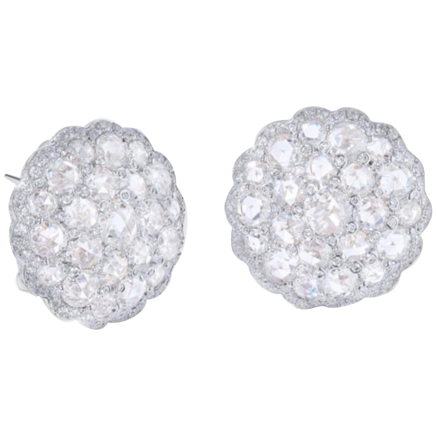 Gorgeous Rose Cut and round brilliant diamond cluster stud earrings are beautifully hand crafted in 18 K white Gold. 
The details are as follows : 
Diamond weight : 6 carat ( GH color and VS clarity ) 
Metal : 18 K White Gold 
Gold Weight : 17.80
