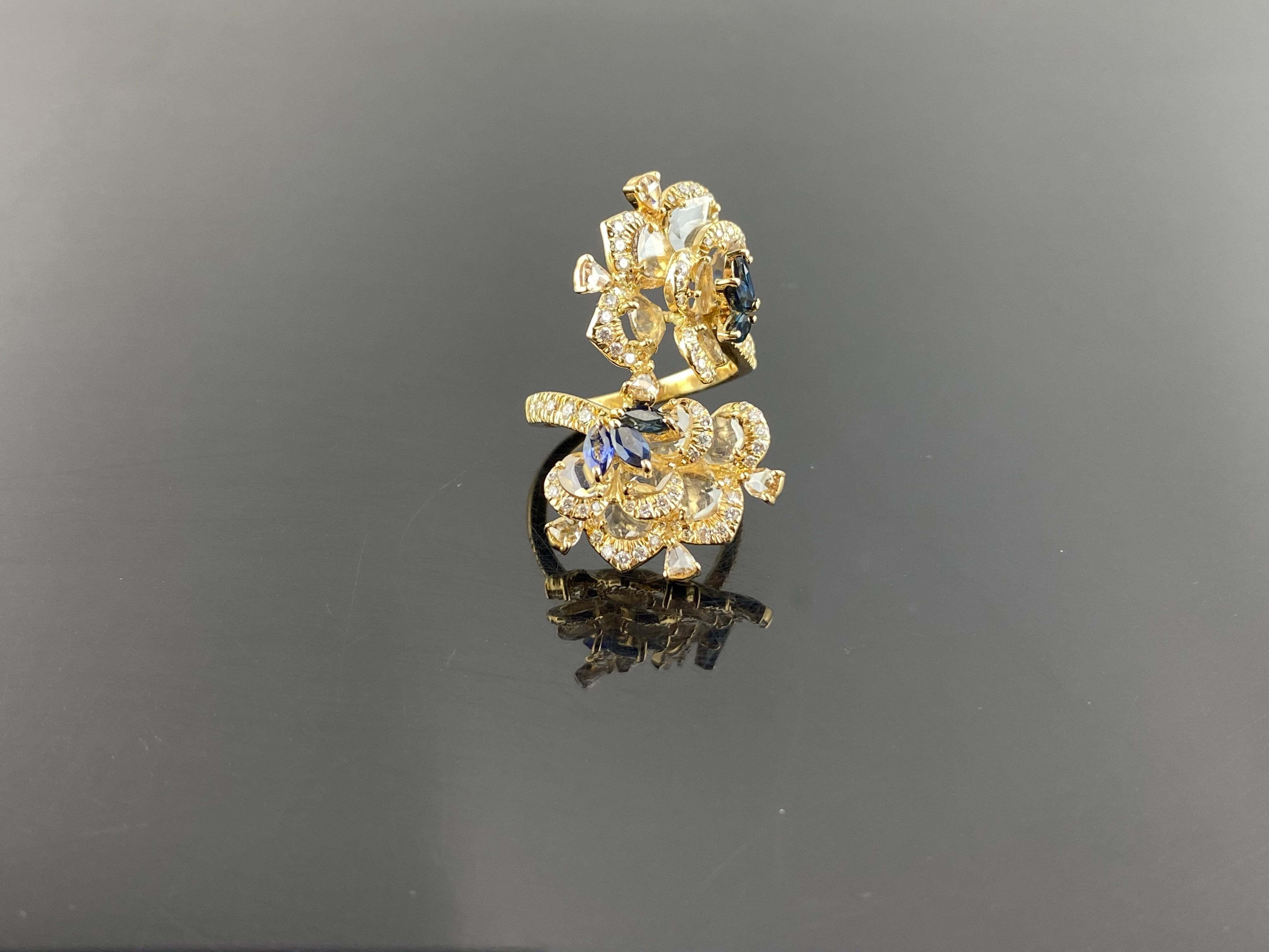 A beautifully handcrafted, 1.18 carat Blue Sapphire and 2.39 carat rose cut Diamond ring, set in solid 18K Yellow Gold. Currently sized at US 6.5, can be resized. 
Please feel free to message us for more information. 
We provide free shipping, and