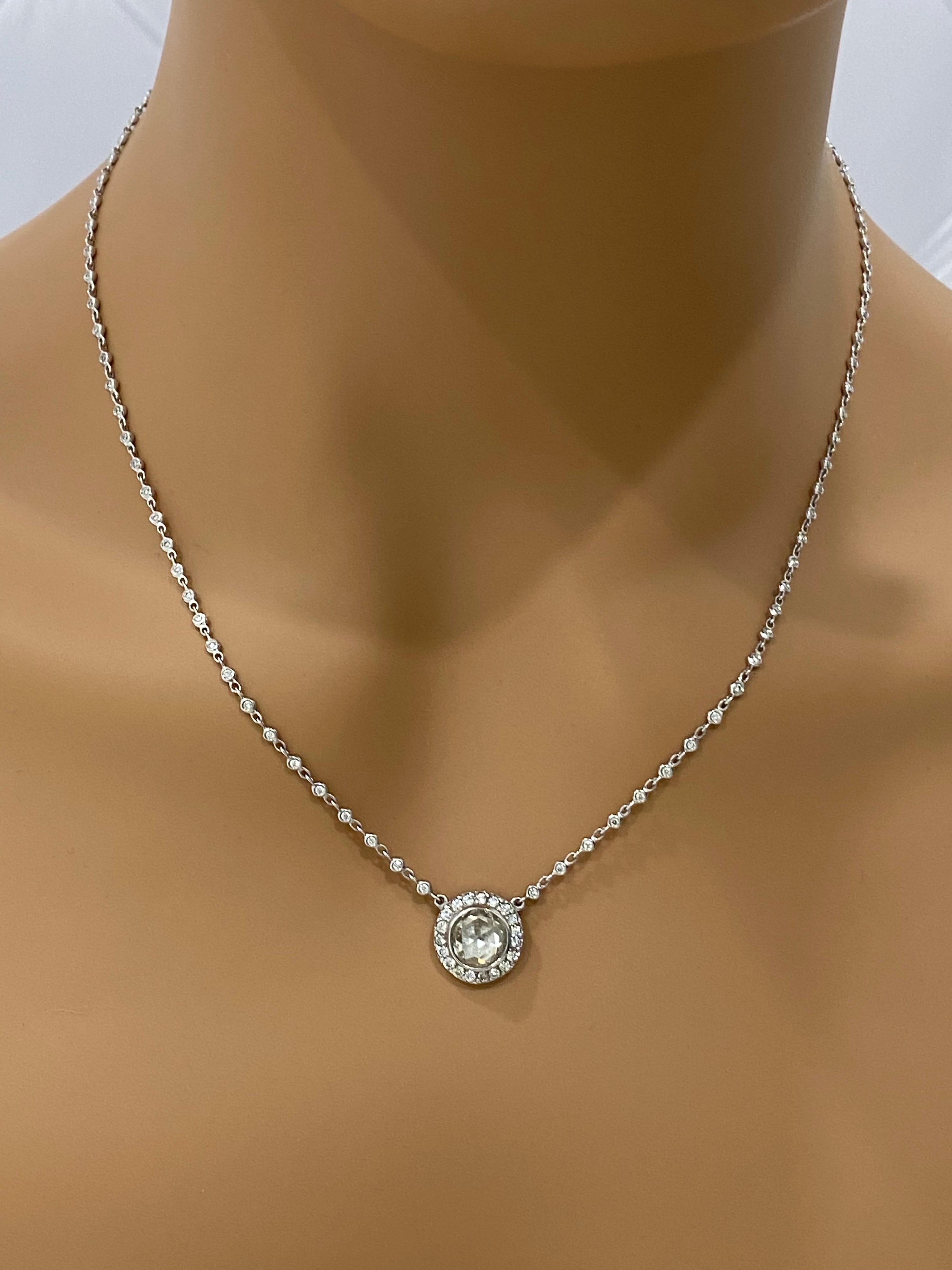 The perfect everyday necklace that goes right into evening attire. So elegant with just the right amount of bling! 
Center old rose cut diamond = 1.75 CTW 
SI, K Color set in an antique style silver/ gold halo setting. 19 round brilliant diamonds