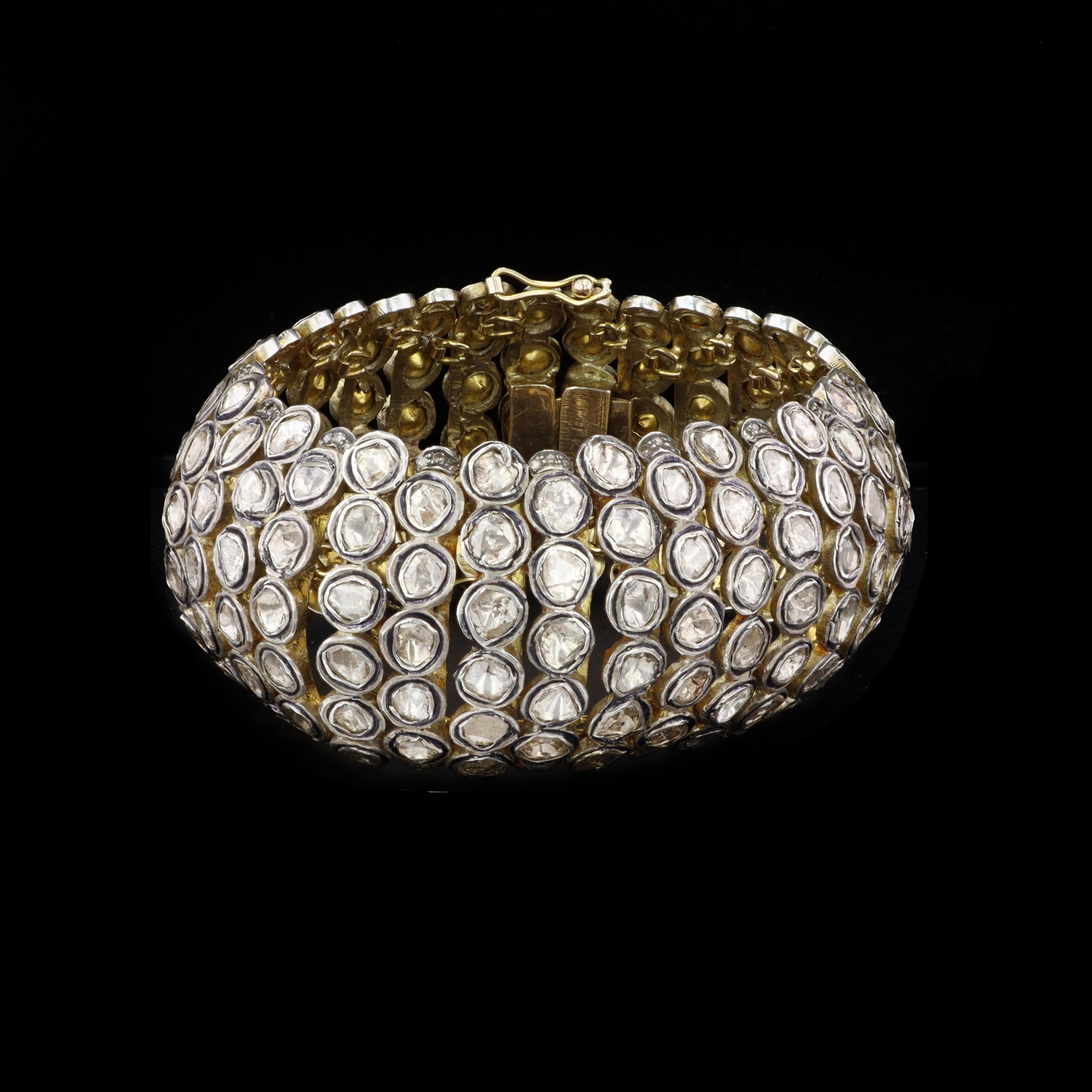 A unique and dazzling estate bracelet, this 14k yellow gold and silver 6 line diamond bracelet contains 21.67 carats of diamonds.

Length: 7.5 in
Width: 1.5 in