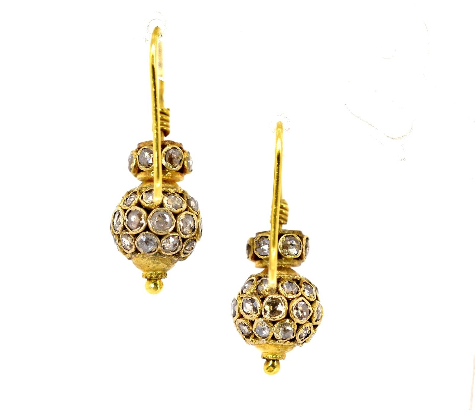 These handmade 20KT yellow gold earrings are an eye catcher!  Designed like Moroccan lanterns they are set with seventy six raw cut Rose Diamonds weighing a total of approx. 1.70 carat of I/J color - SI clarity; the diamonds timidly shimmer as the