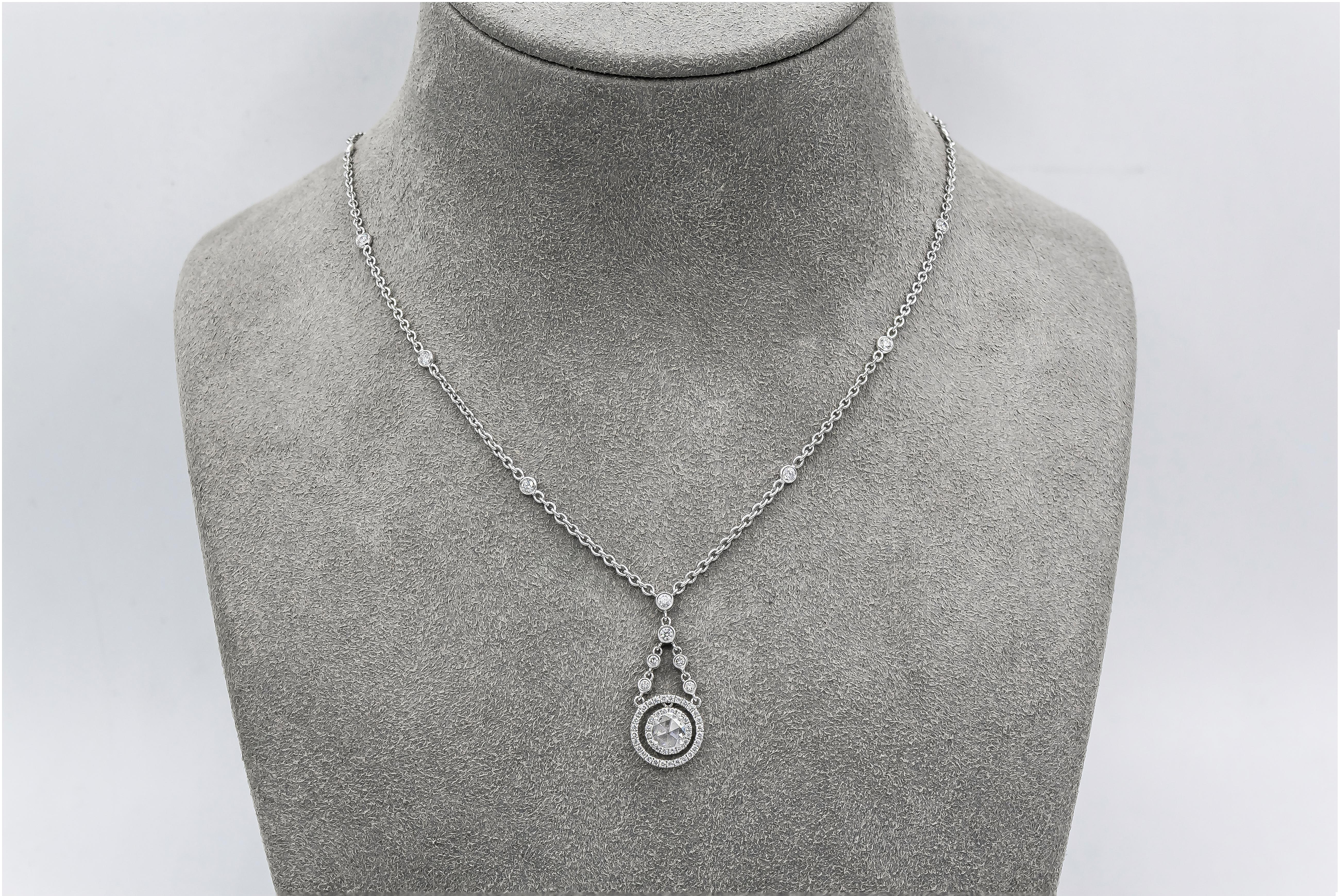 Showcases a single rose cut diamond weighing 0.33 carats, surrounded by two rows of round brilliant diamonds. Attached to a short diamonds by the yard chain that slowly comes together to the longer diamonds by the yard chain. Accent diamonds weigh