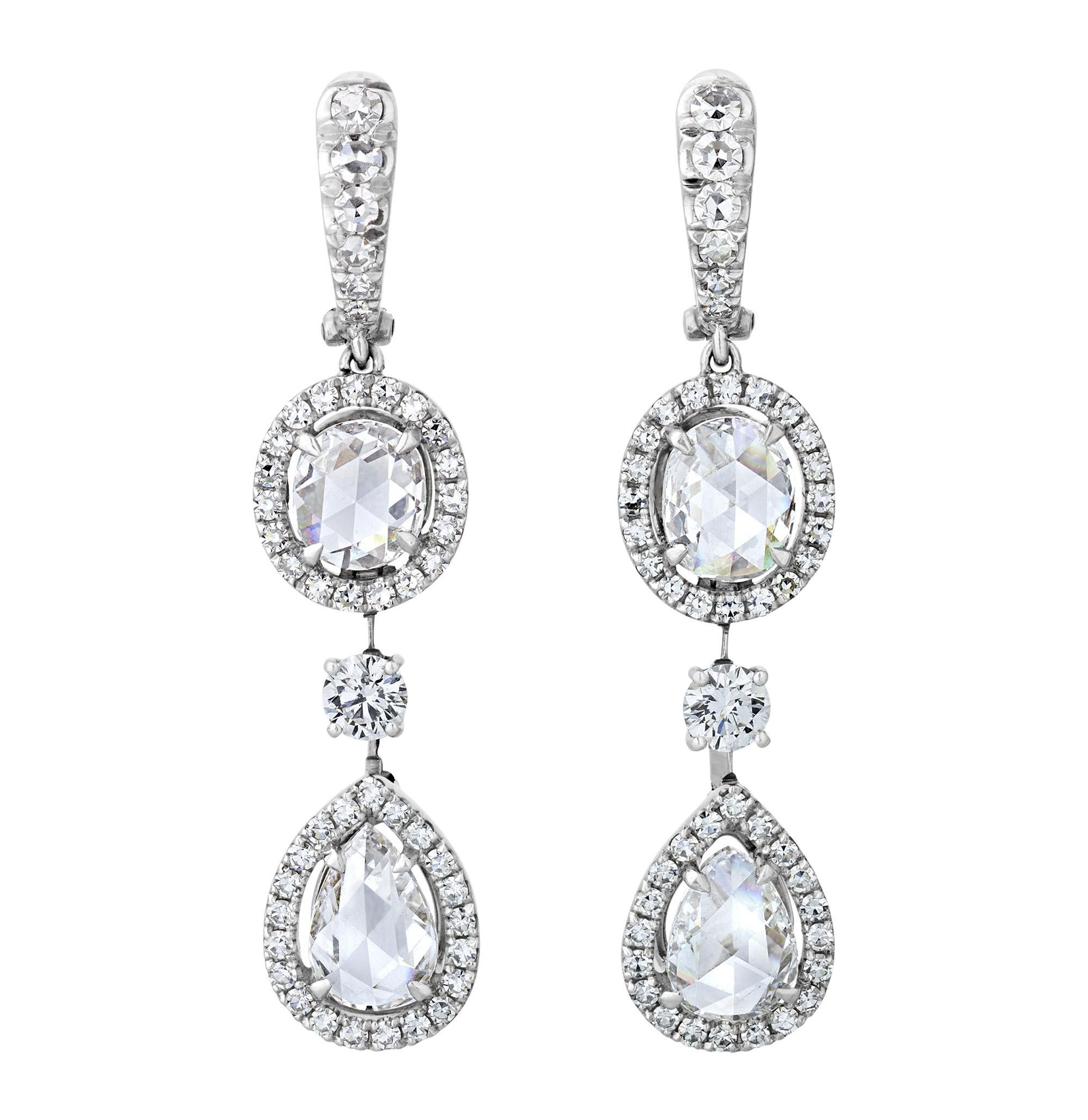 This exquisite matching set of a diamond necklace and earrings showcases an impressive 42.11 carats of rose cut diamonds, complemented by 19.17 carats of round brilliant-cut diamonds. Designed reminiscent of great Victorian jewelry masterpieces, the