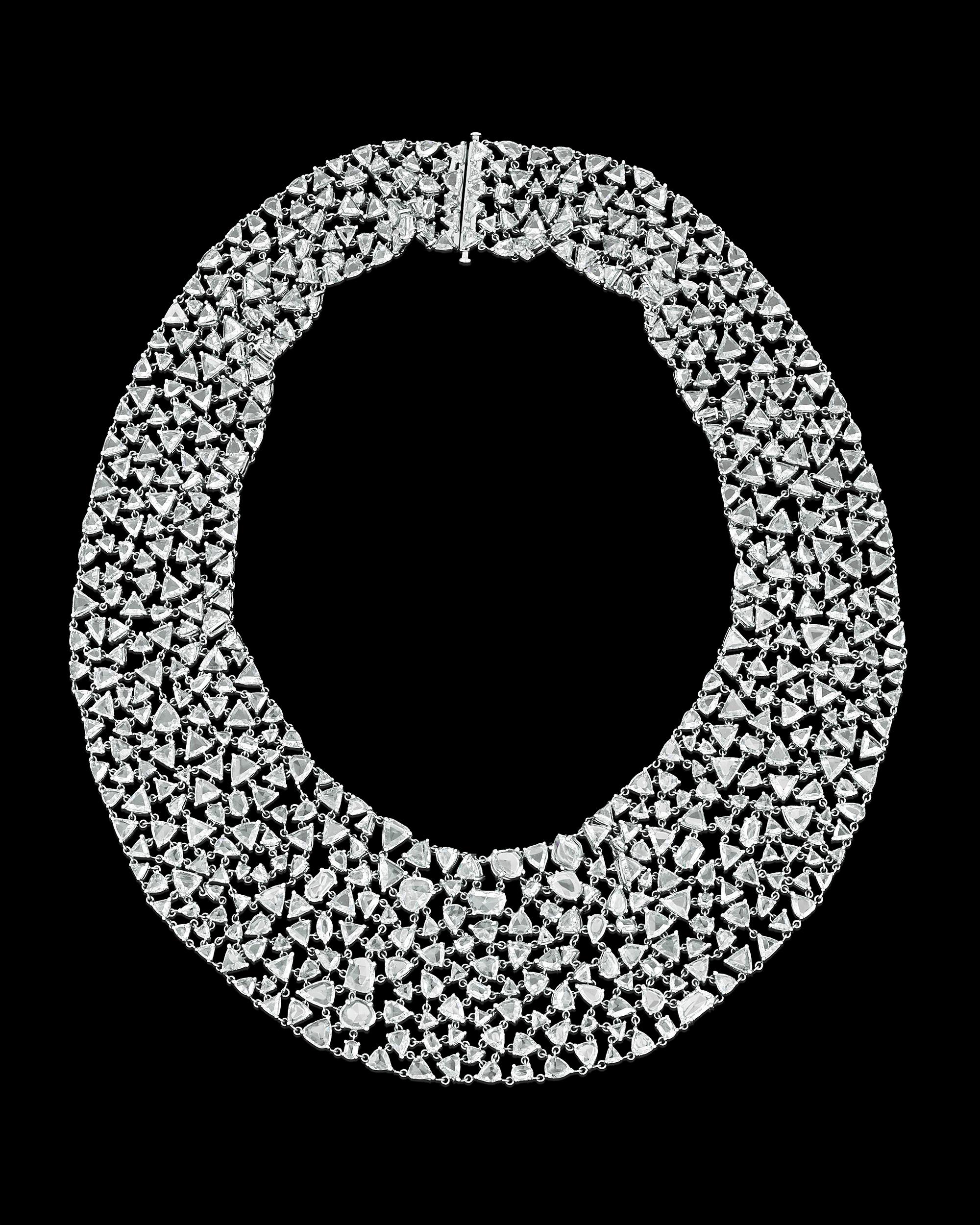 A marvelous array of rose-cut diamonds cover this spectacular 18K white gold necklace. The jewels weigh approximately 110.00 combined carats and are cut in oval, pear, round, trilliant and other dazzling shapes that are meticulously linked together