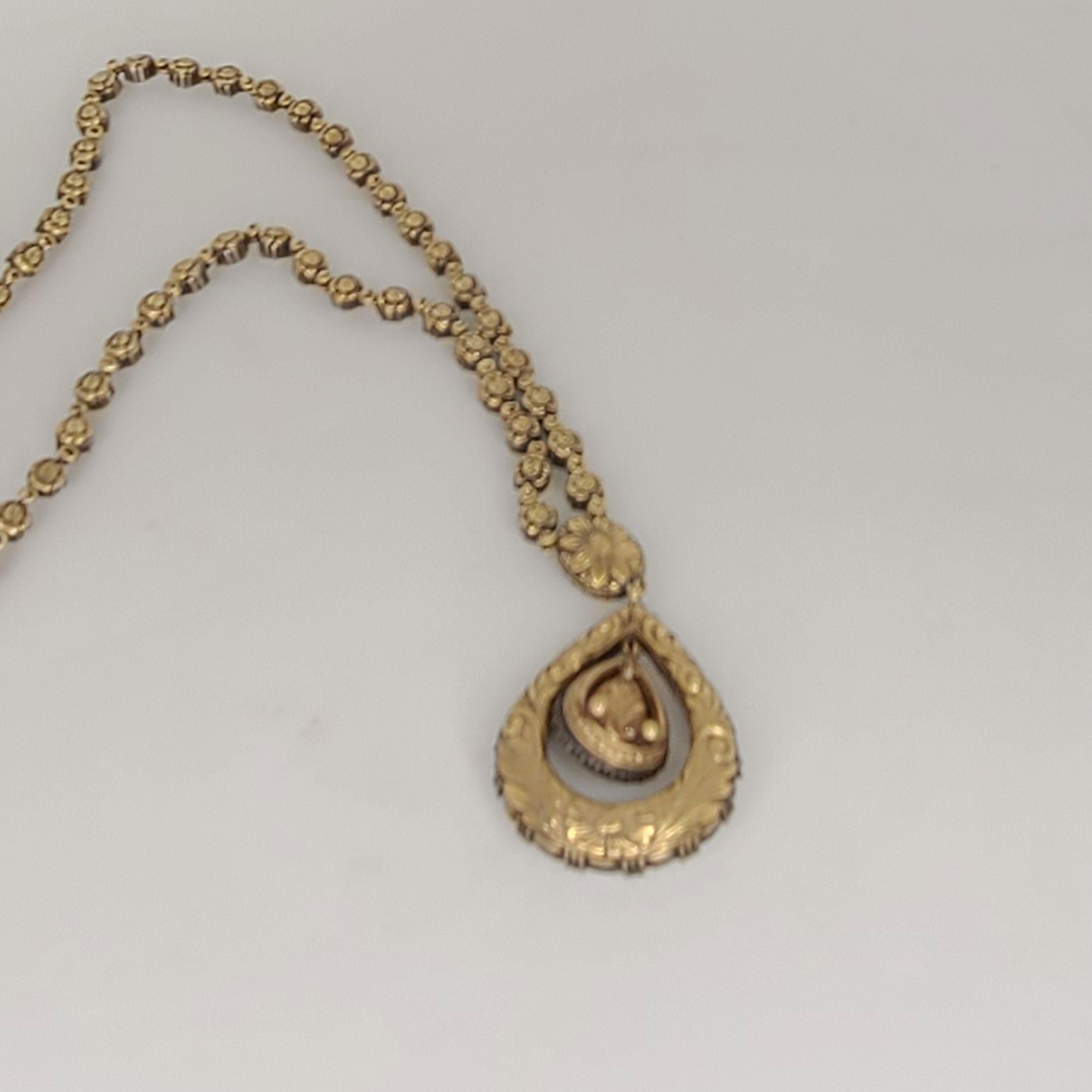 This one of a kind 18K Gold Necklace has a pear shape rose-cut Diamonds of 1.36cts. The rest of the rose-cut Diamonds are 9.71 cts. This necklace is 16 inches long. it is made in 18K Gold, however the rose-cut Diamonds are set on a sterling silver