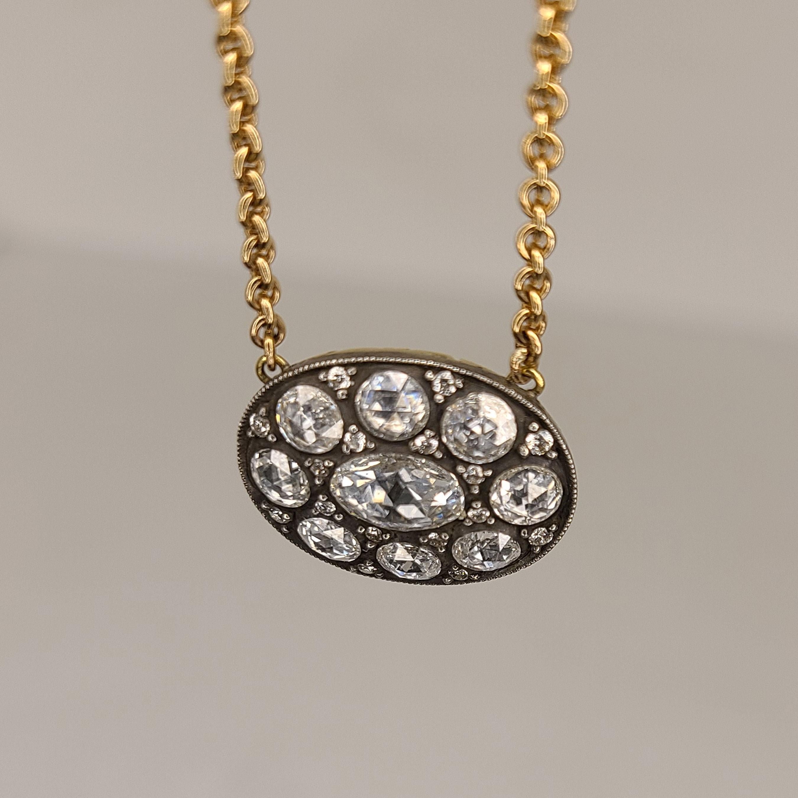 This one of a kind 18K Gold cluster necklace has rose-cut Diamonds of 1.39cts. The chain is 20 inches long and can be easily resized upon order. It is made of 18K Gold, however the rose-cut Diamonds are set on a sterling Silver just like in its