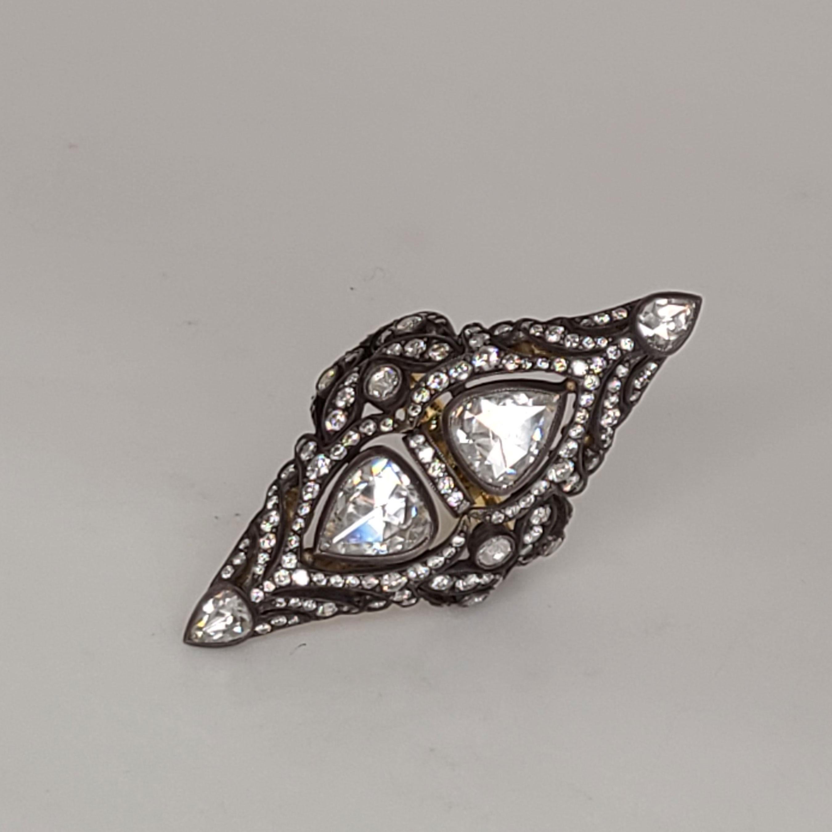 This one of a kind 18K Gold Ring has 2 pear shape rose-cut Diamonds about 1cts each of them. The accent Diamonds complementing the rose-cut Diamonds are 1.65cts. This ring is 5.75 in size as is and can be resized upon order. The ring is made of 18K