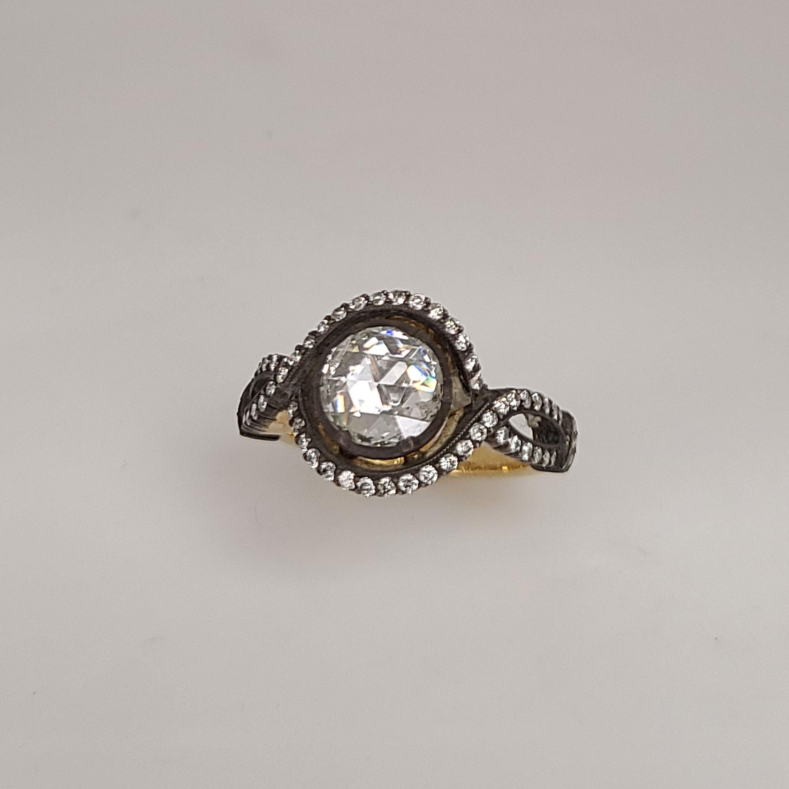 This is a one of a kind 18K Gold Ring and it has 1 center rose-cut Diamond of 1.21cts on top of the ring. The Diamonds complementing the rose-cut center Diamond are round brilliants of 0.41cts. This ring is 6.75 in size as is and can be resized upon