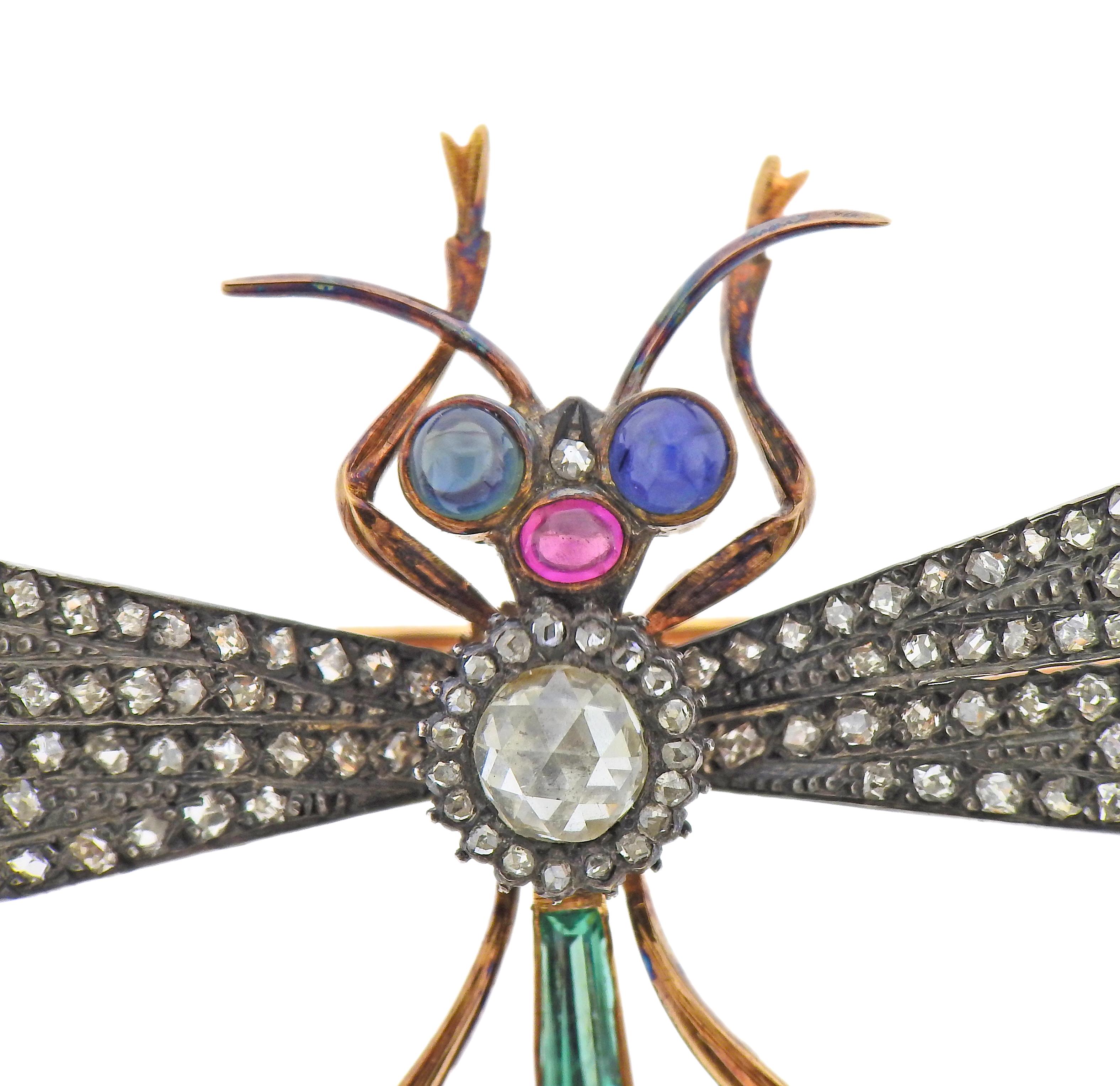 Large silver and 18k gold dragonfly brooch, set with rose cut diamonds (center stone is approx. 5.3 x 5.4mm), sapphire eyes, rubies and emeralds.  Brooch measures 80mm x 90mm. Weight - 22.1 grams.