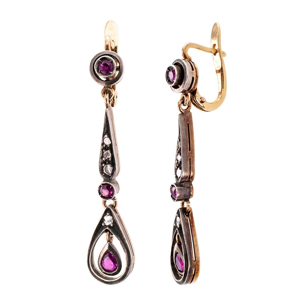 Rose-cut diamonds rubies silver and gold estate earrings. The articulated designs feature rose-cut diamonds and rubies set in silver over 14-karat gold. We love the romantic look of these estate earrings, elegant enough for when you are all dressed