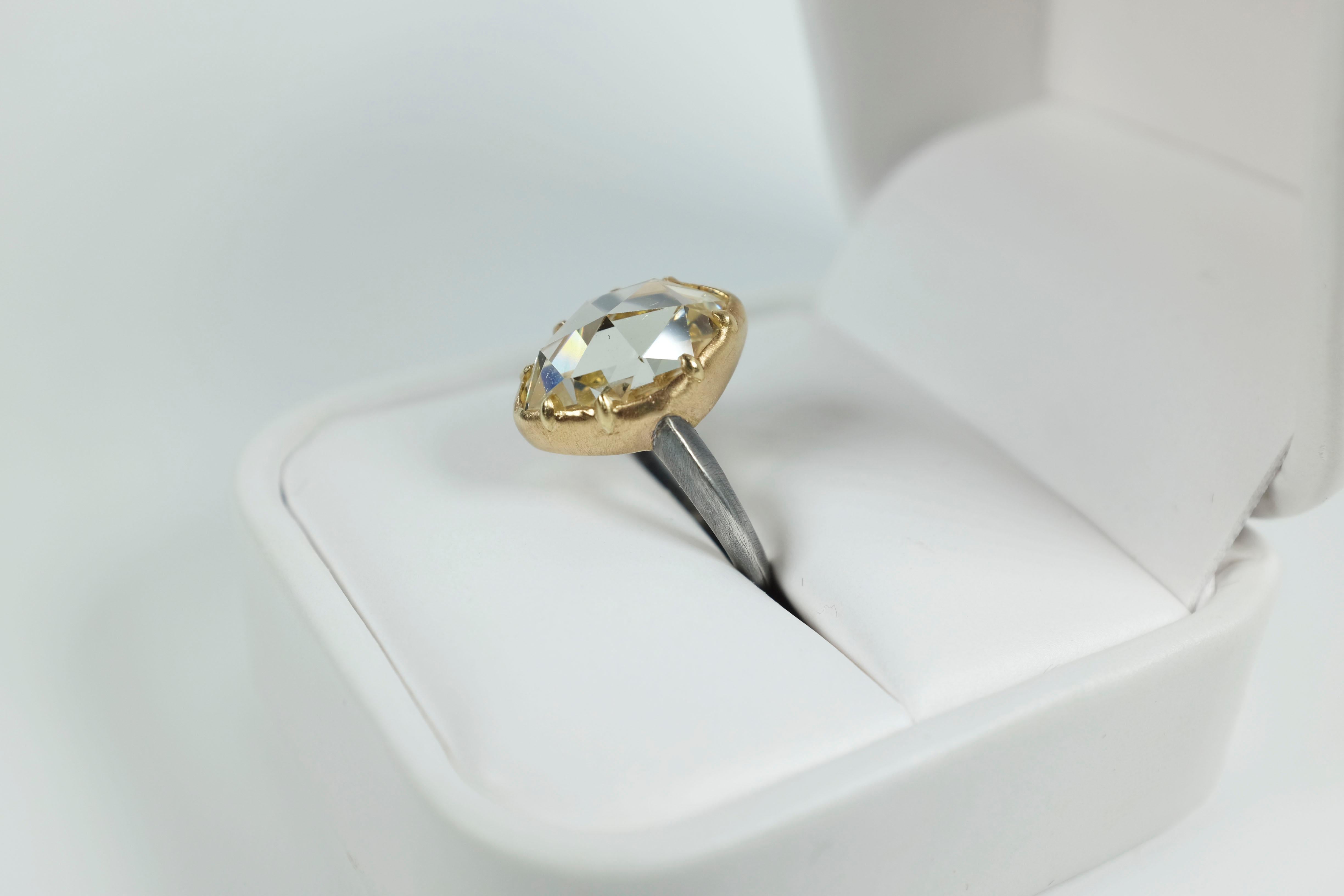 Far too lovely to believe.  This 4.81 carat rose-cut diamond solitaire is  far from the mainstream; it's for rockstars and designers, artists and celebrities.  Unless you've seen this one before, it's unlike anything you've seen, claw set with 18k