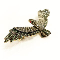 Broche oiseau en argent et or jaune 18 carats avec diamant taille rose, tsavorite et rubis