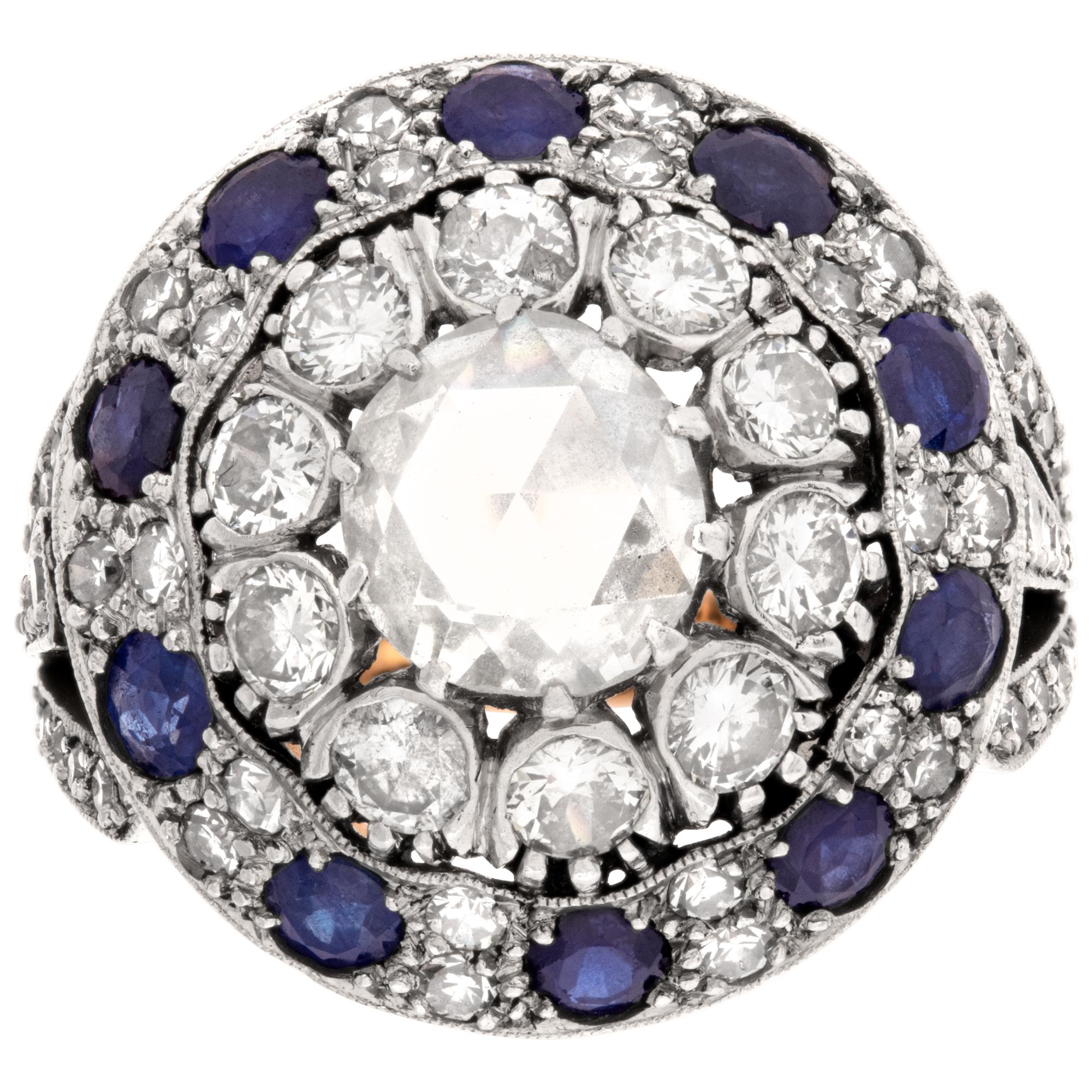 Rose cut diamond and sapphire ring in 18k white and rose gold, with over 3 carats in rose cut diamonds and 0.50 carats in blue sapphires. Center rose cut diamond approximately 1 carat H-I color, VS clarity. Size 6.5This Diamond/Sapphires ring is