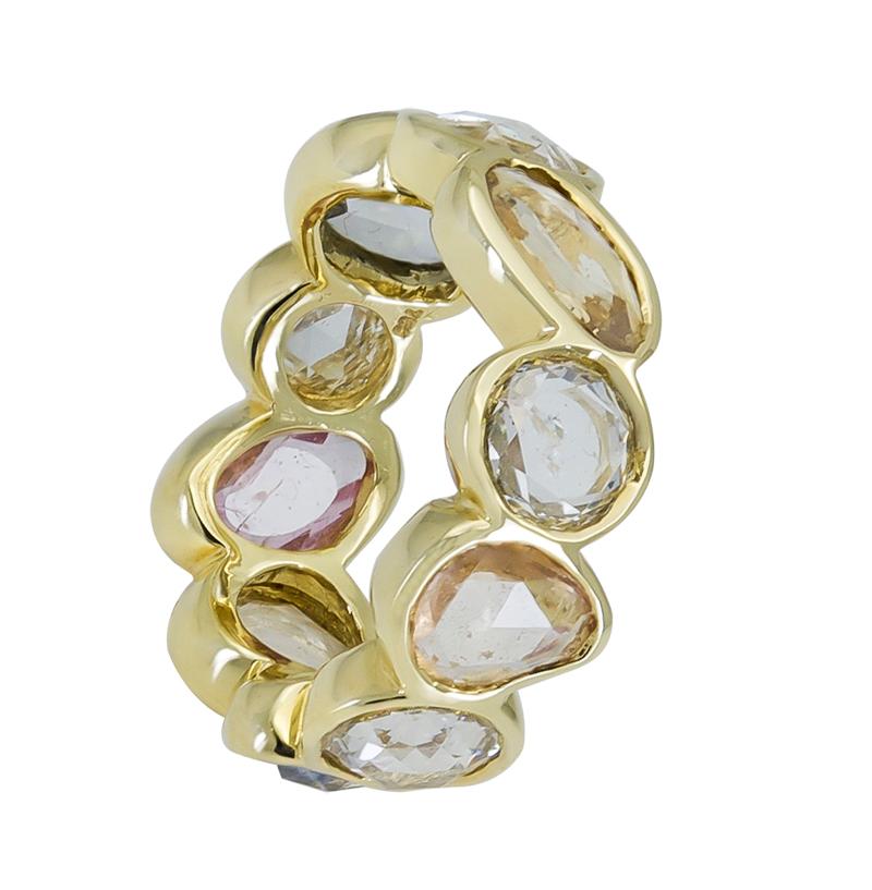 A unique eternity ring showcasing alternating mixed-shape rose cut sapphires and diamonds. Each stone is set in a polished bezel made in 18k yellow gold.
Sapphires weigh 4.16 carats total and come in a variety of colors. 
Diamonds weigh 2.60 carats