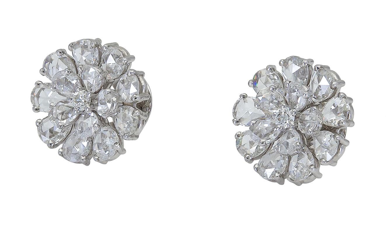 A beautiful exemplification of nature. Floral motif earrings showcasing a brilliant diamond center, surrounded by rose cut pear shape diamond petals. Set in 18k white gold. 
Screw-back posts.
Earrings diameter: 0.70 inches