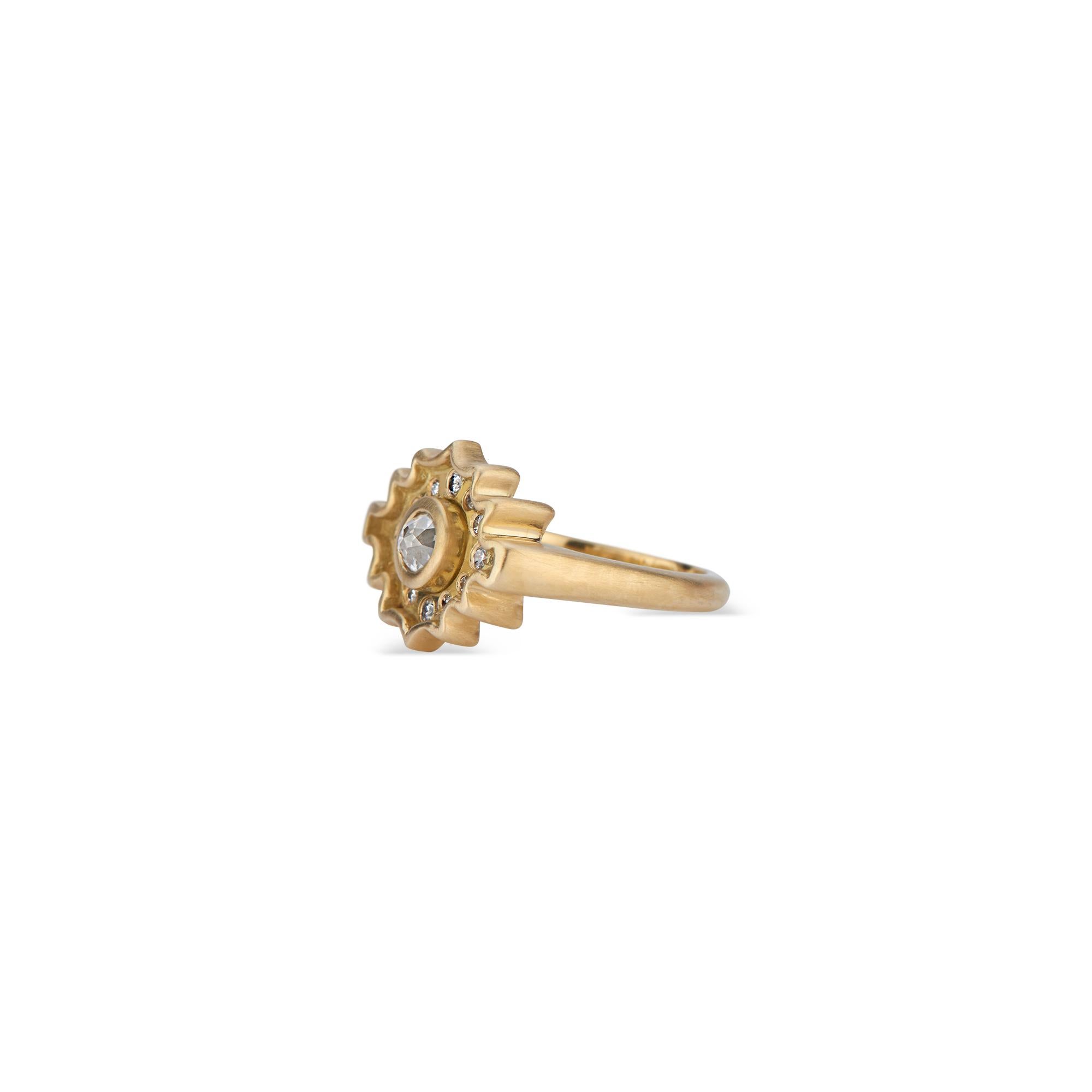 This exclusive design presents the diamond from a new perspective. The central salt and pepper rose cut diamond (approximately .31 carat total carat weight) of this 18k yellow gold ring is a departure from the ubiquitous brilliant cut diamond. The
