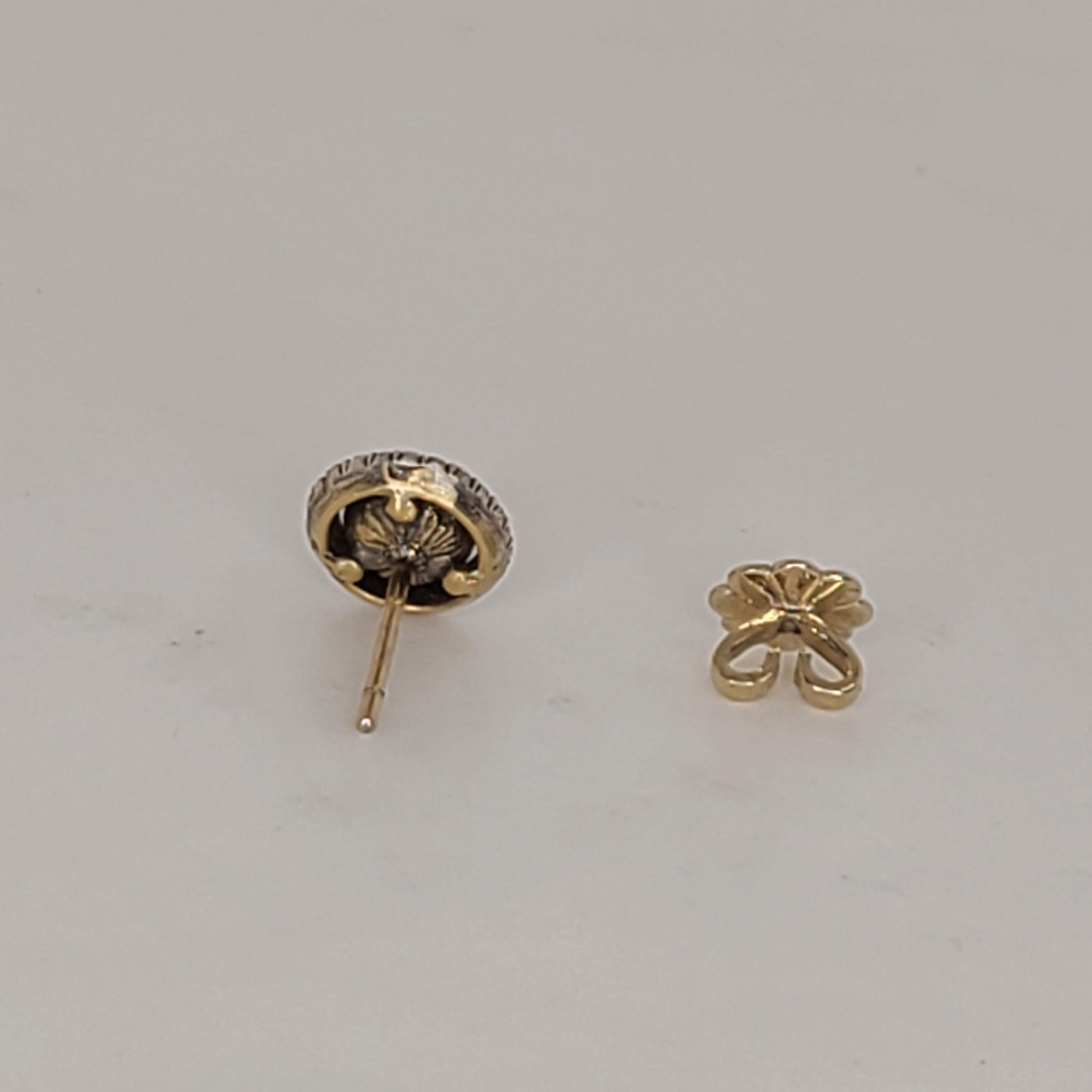 This 18K Gold stud earrings have 0.65cts of rose-cut Diamonds and are surrounded by 0.32cts of round brilliant Diamonds. The rose-cut Diamond is a charismatic stone and its fire and sparkle is quite different than easily found round brilliant cut