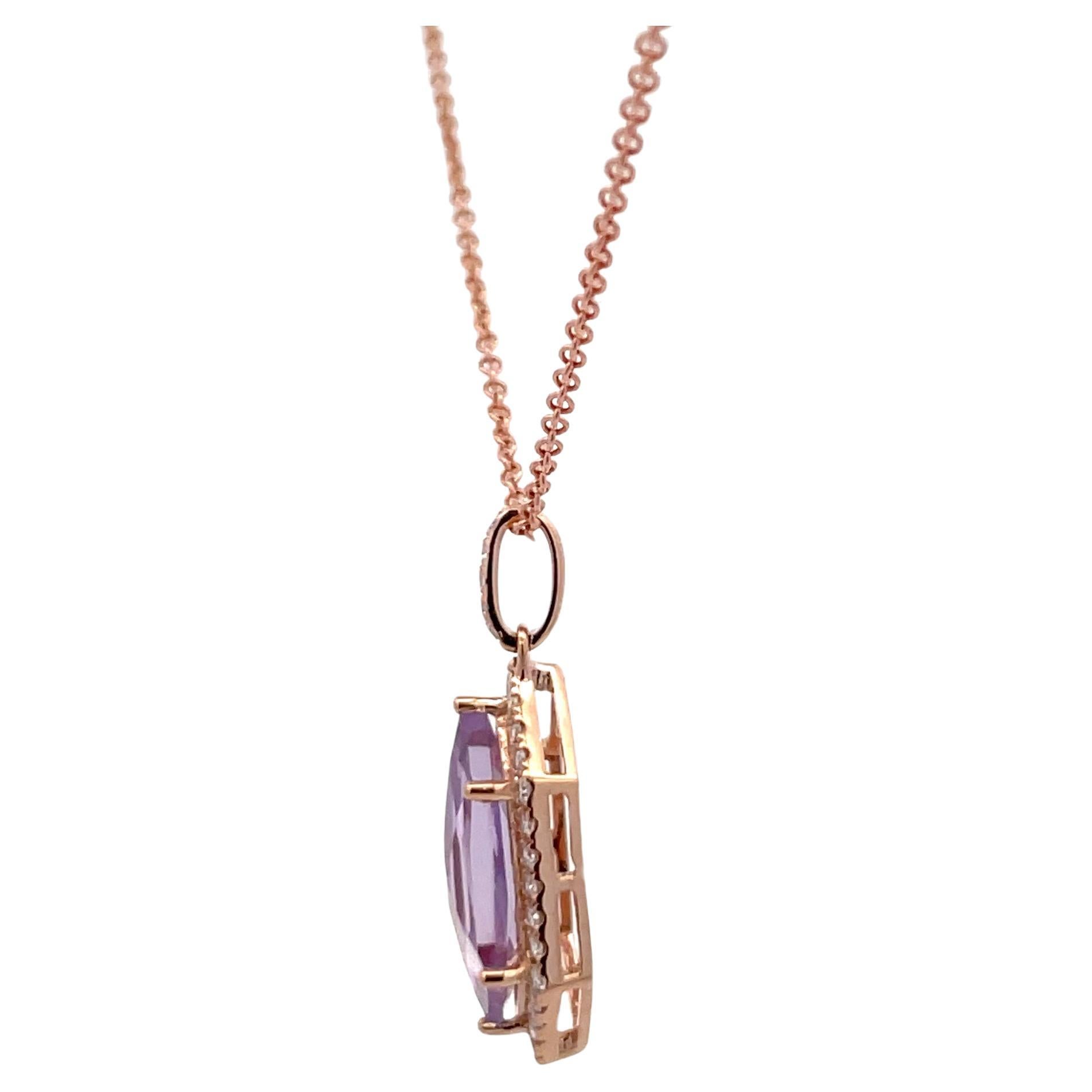 Hexagon shape Rose De France Amethyst weighing 2.57 carats flanked with 33 round brilliants weighing 0.31 carats in 14 karat rose gold. 
Amethyst 
16 MM *6.1 MM

Pendant without bail
19.5 MM * 8.8 MM