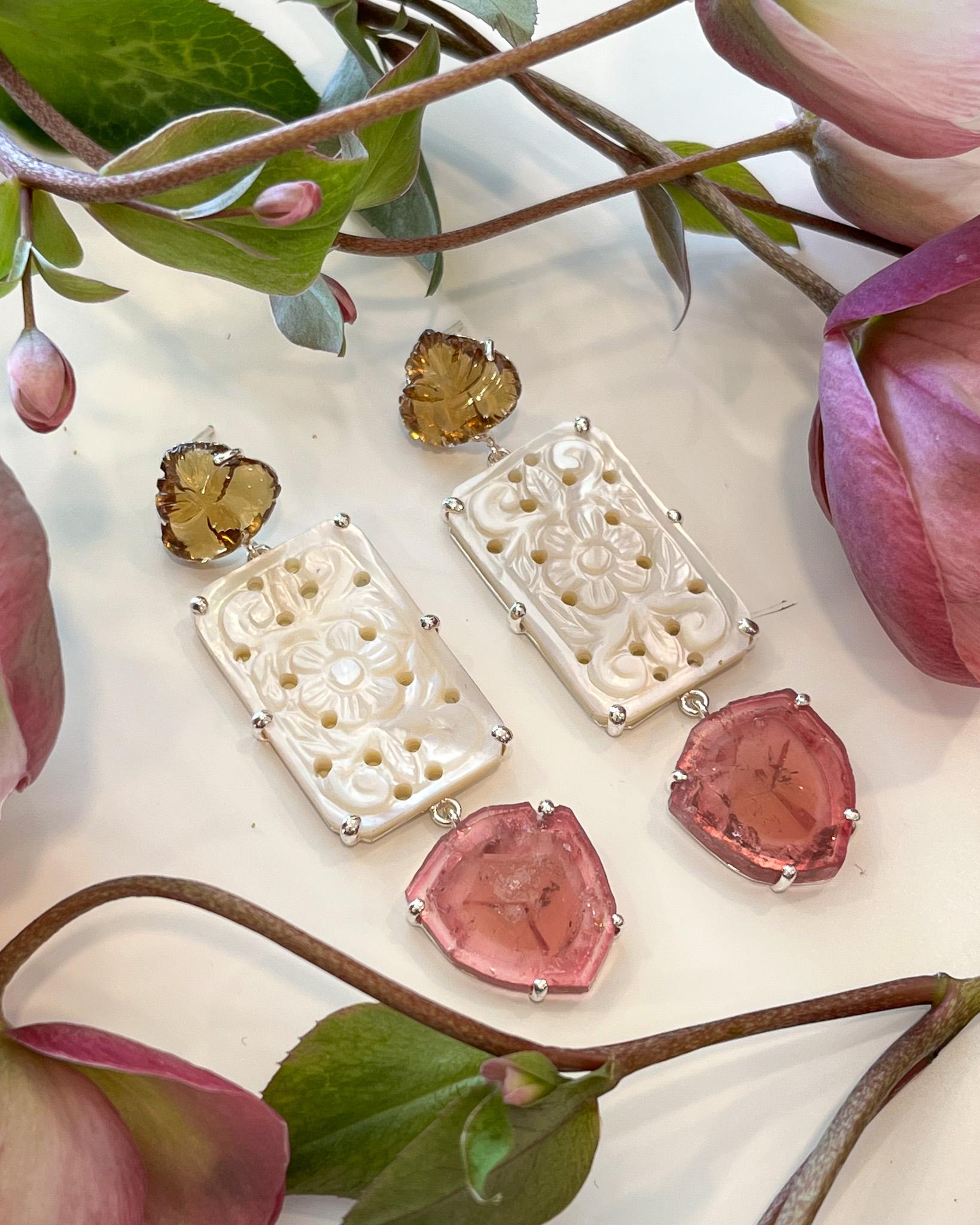 Intention: New love

Design: Big, bright and full of joy, the Rose Earrings feel like new love. The details on these are stunning: hand-cut leaf cognac quartz, large floral hand-cut mother of pearl, and slices of translucent, juicy pink tourmaline.