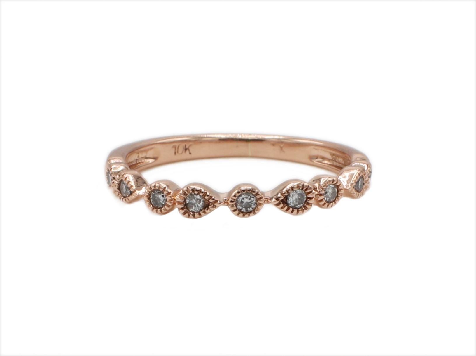 Rose Gold .10 Carat Natural Diamond Stackable Band Ring Size 5
Metal: 10K rose/pink gold
Weight: 1.31 grams 
Diamonds: Approx. .10 CTW I VS-SI natural diamonds
Size: 5 (US)
Band is 1.7 - 2.3MM
