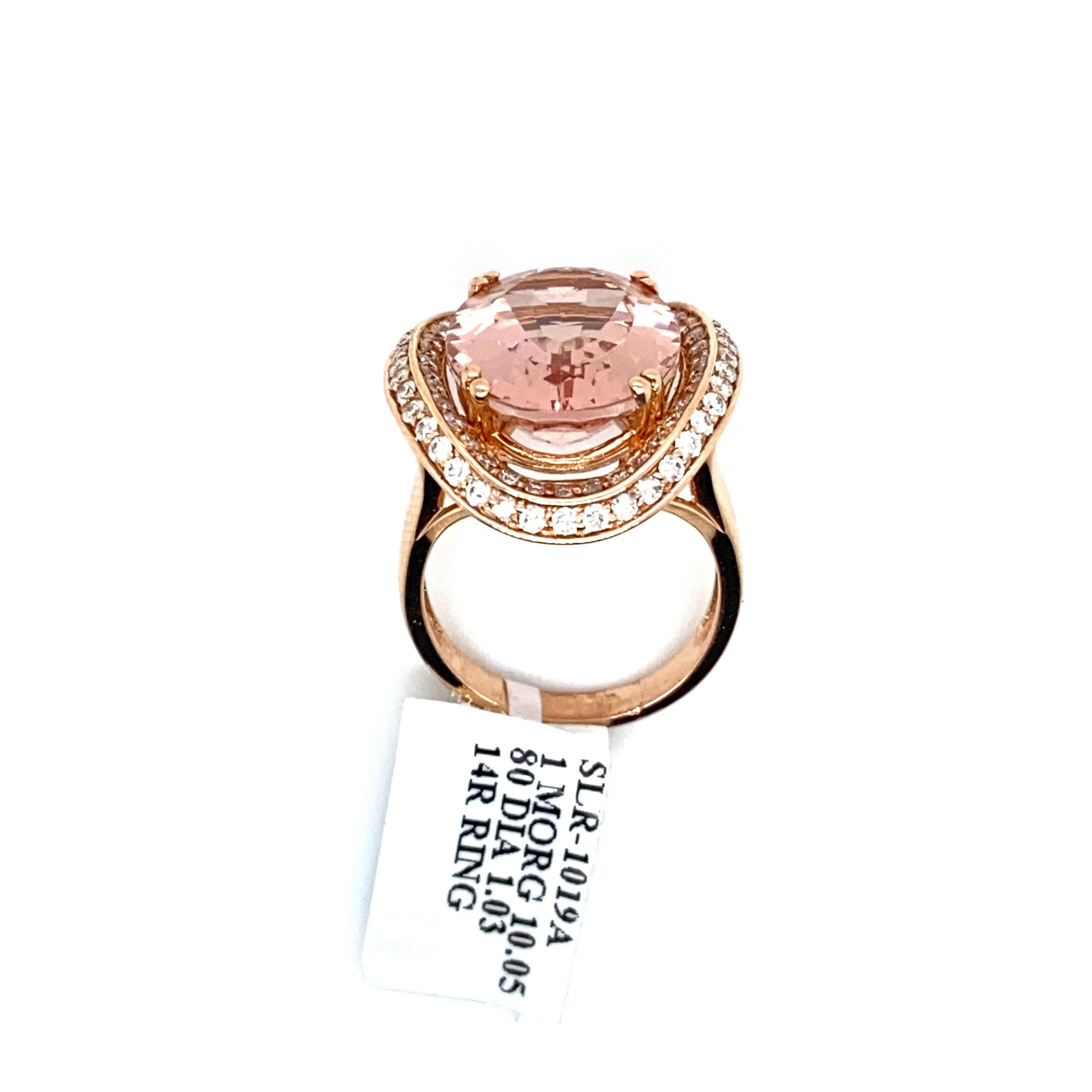 This is a large and magnificent natural morganite and diamond cocktail ring set in solid 14K rose gold. The natural 10.05 Ct morganite oval (Over 10 carats of a AAA quality gem!) has an excellent peachy pink color and is set on top of a curved