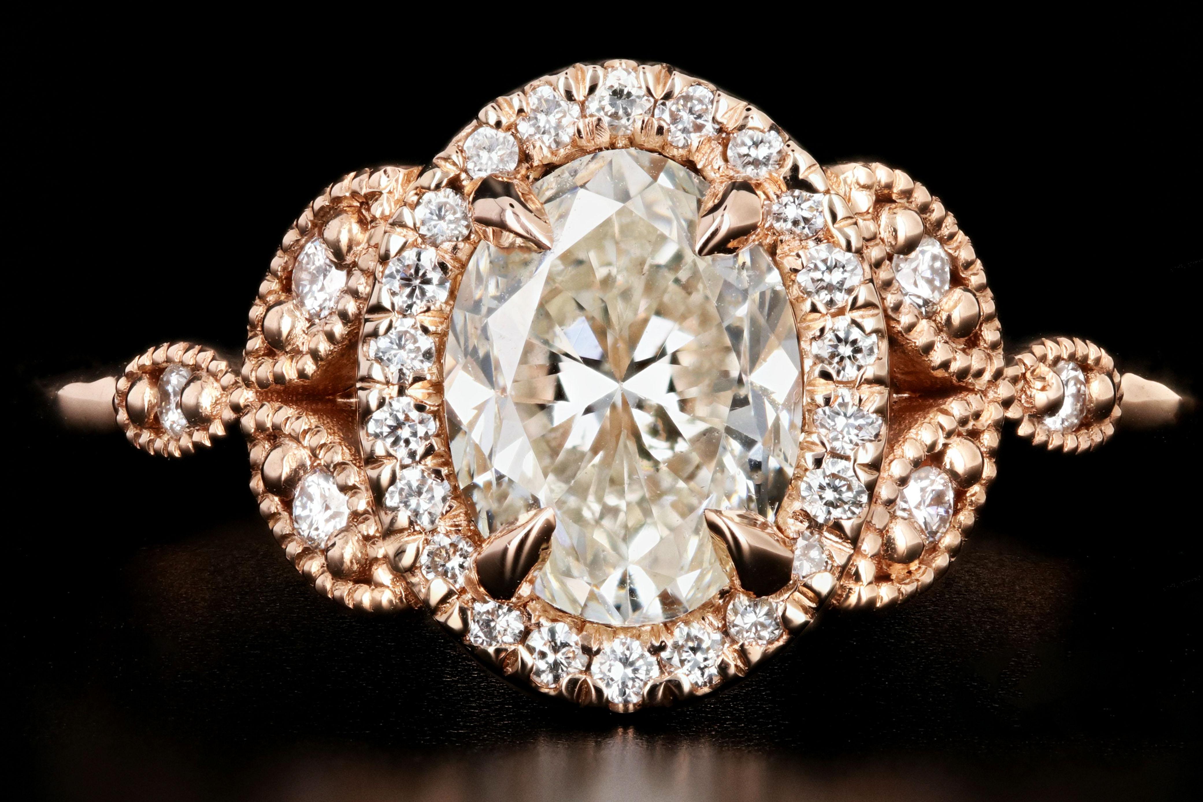 Era: New

Composition: 18K Rose Gold

Primary Stone: Oval Cut Diamond

Carat Weight: 1.22 Carats

Color: J

Clarity: SI2

Accent Stone: Round Brilliant Cut Diamonds

Carat Weight: .17 Carats

Color: G-H

Clarity: Vs

Total Carat Weight: 1.39